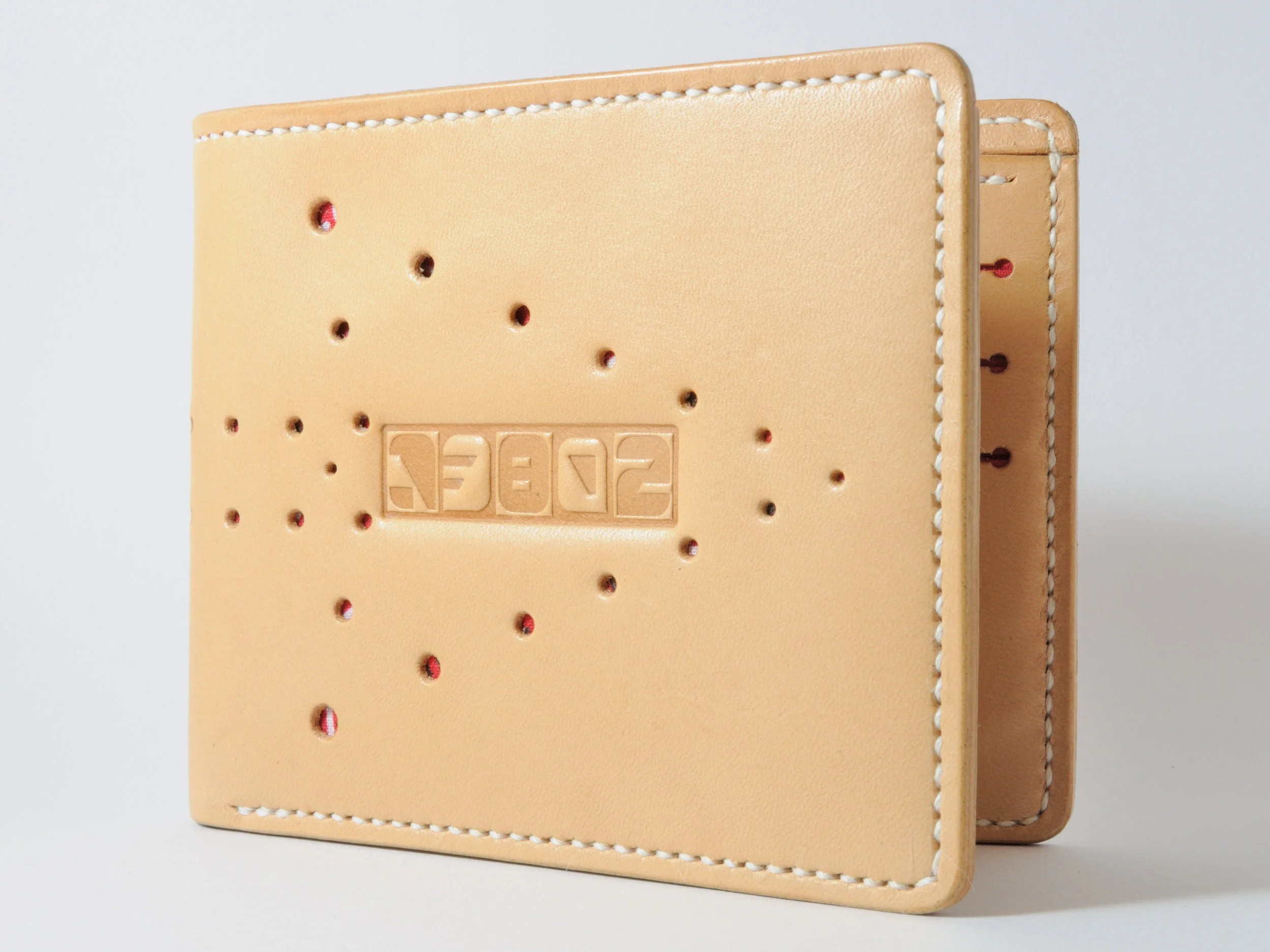 Natural leather w/ Arrow hole punched pattern & red bandanna liner