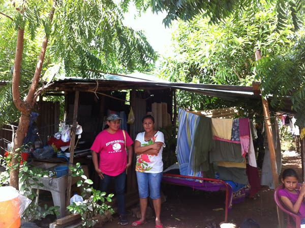 Lady with 3 children living under shed roof in Cristo Rey. We built her a new home.