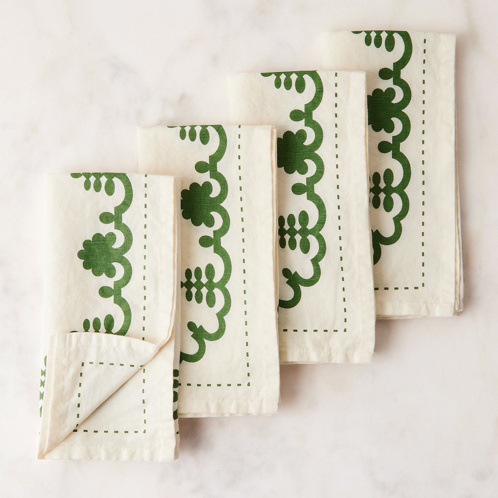 1012-1011_food52_mergentime-garland-napkins-set-of-4_white-w-green_silo_1x1_ty-mecham.jpg