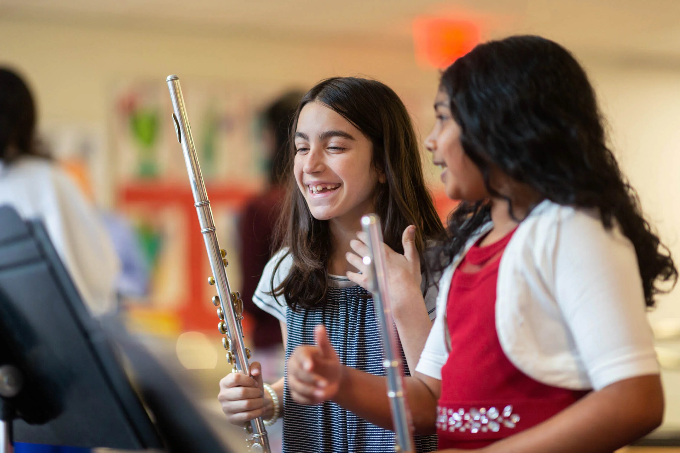Students at a private school participate in music class.