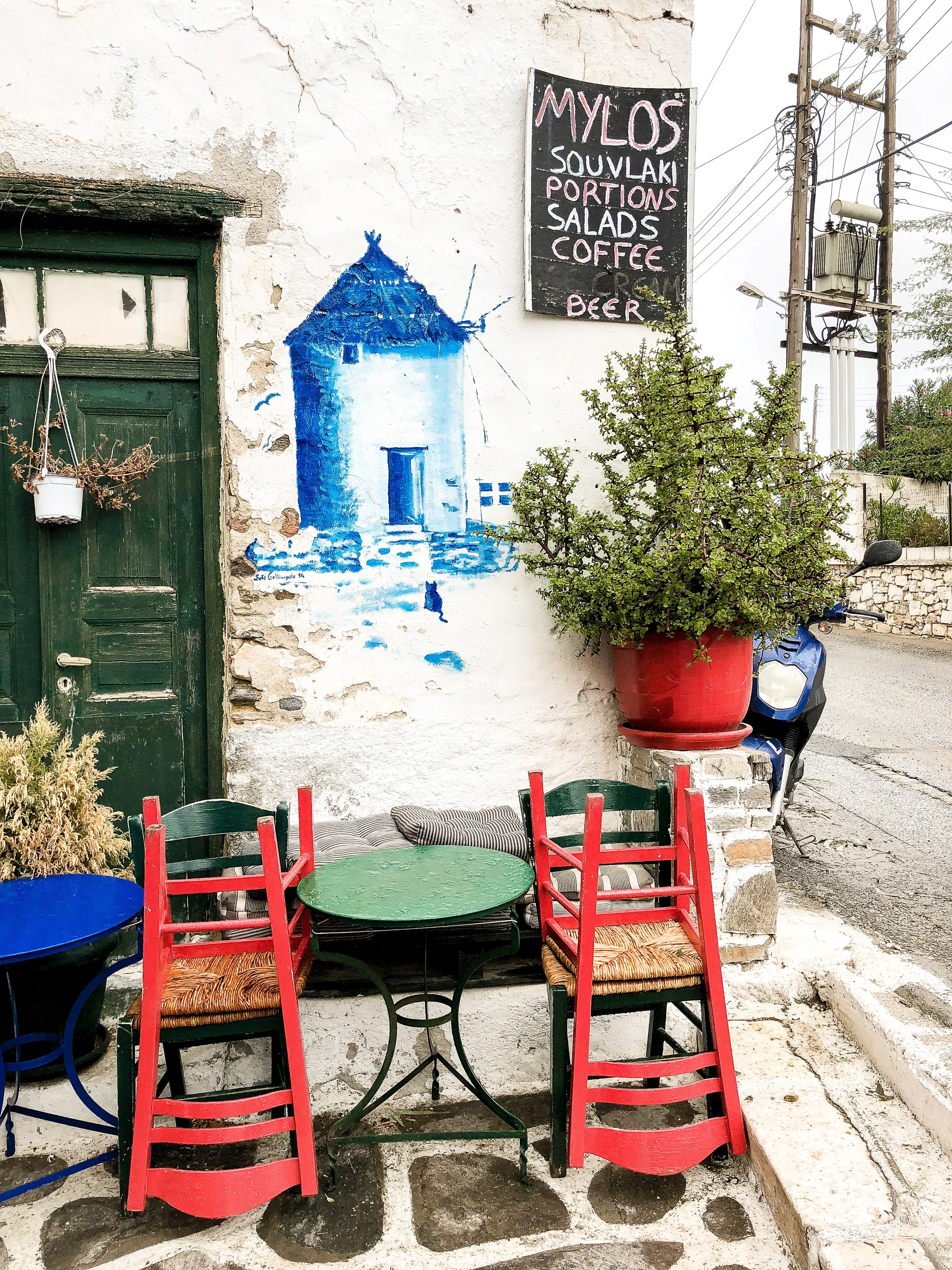 When you find this mural, you have made it to Mylos. Small and tucked away, this place can be hard to find. Just look for two signs in both directions pointing to Mylos, this mural, and an old, non-functioning windmill, and you’ve made it!