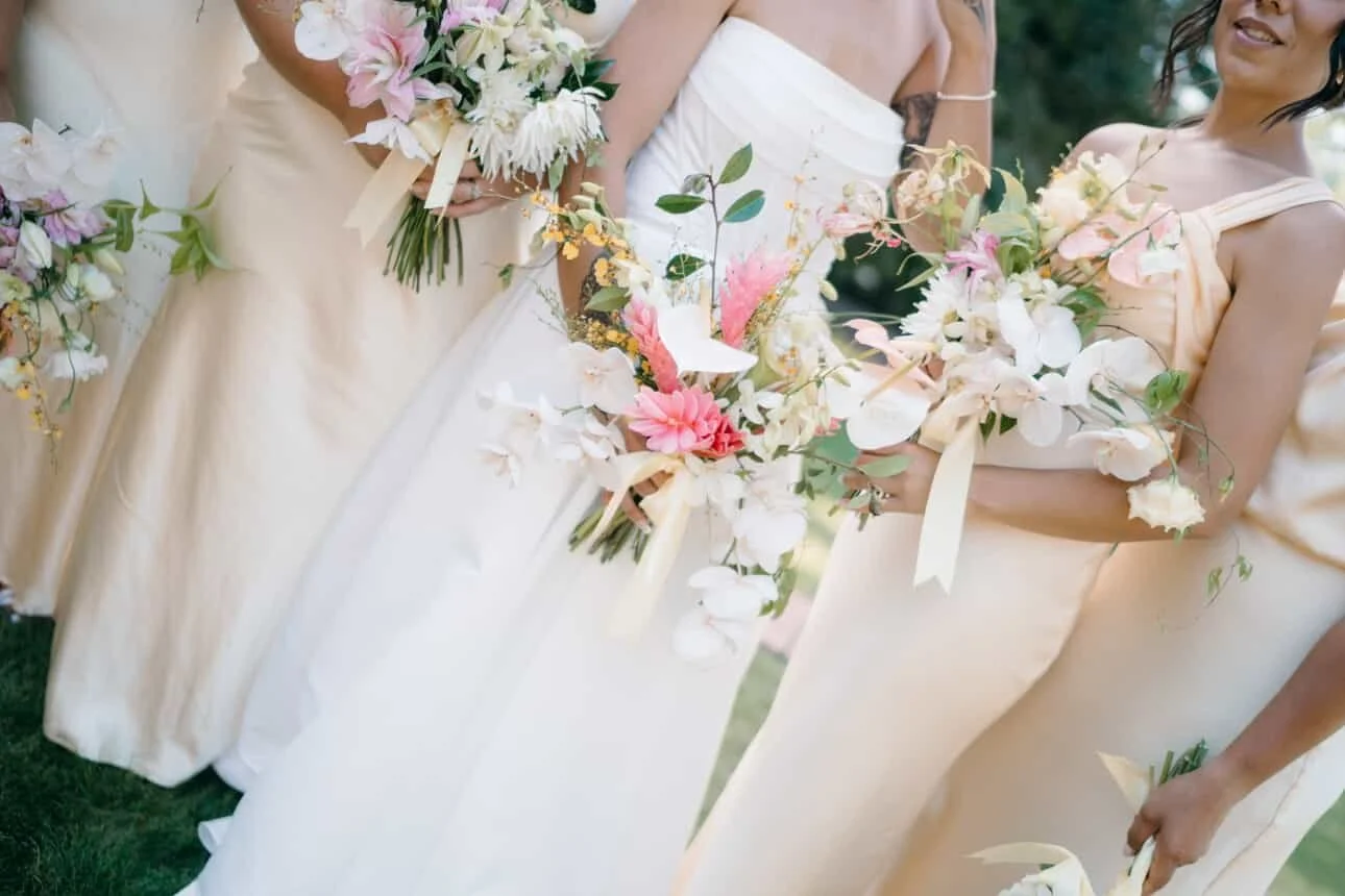 Bride with bridesmaids and bouquets