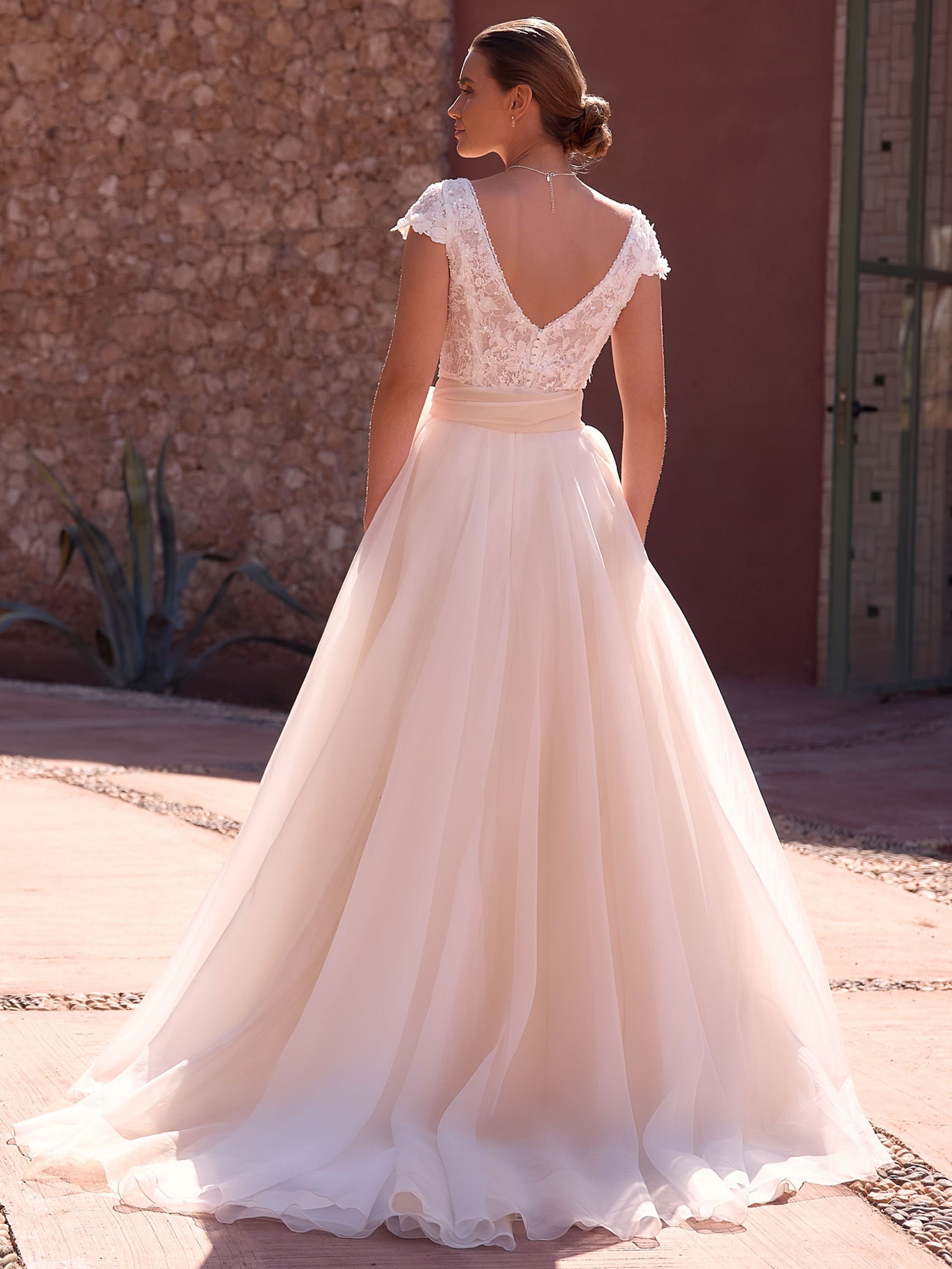 Crafted from high-quality tulle and lace, this bridal top features a flattering V-neckline framed by intricate 3D lace and subtle bead trim for a touch of shimmer