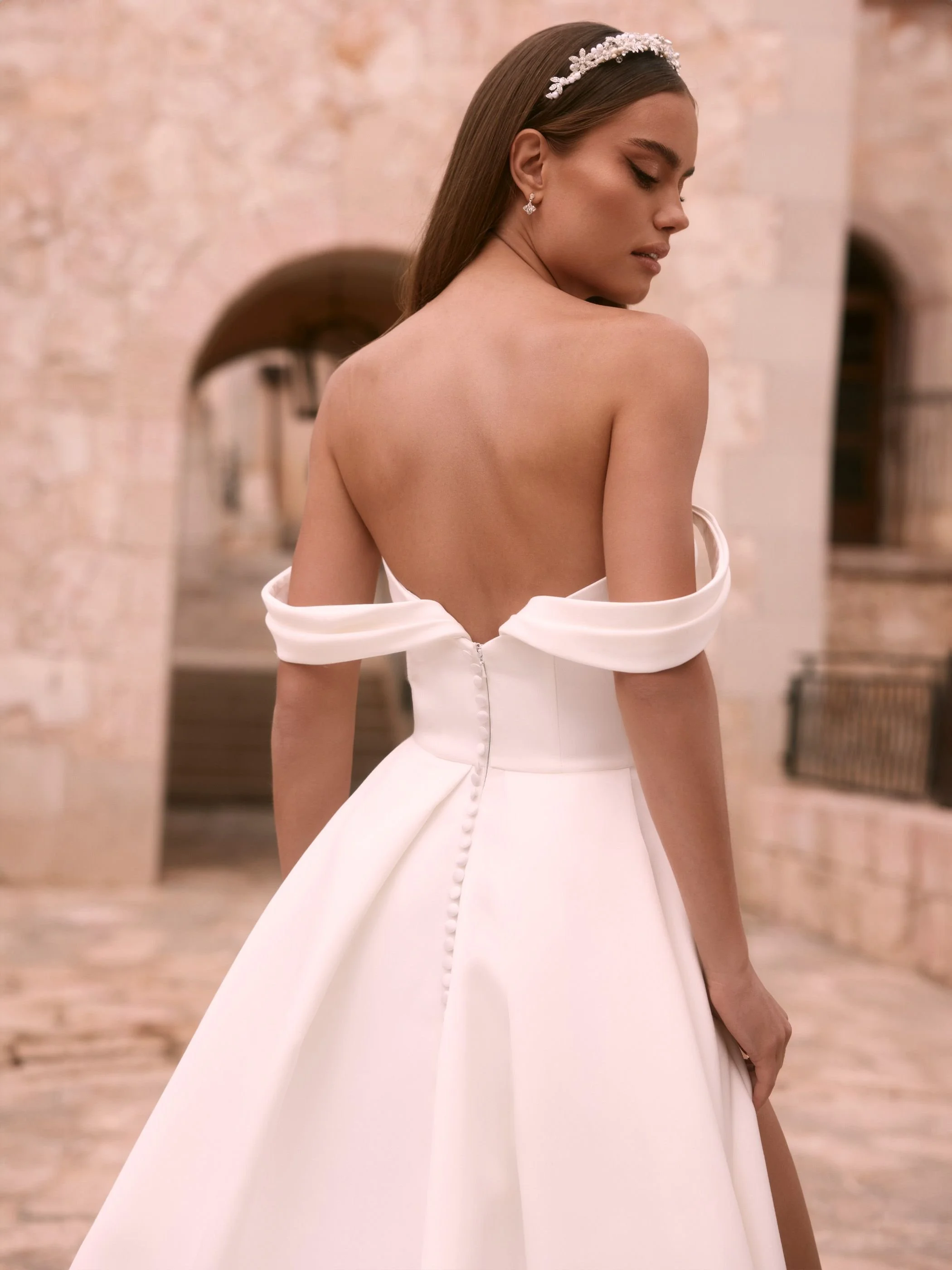 agrias-.jpg sastin bridal gown with under bust draping and arms showing arm drape