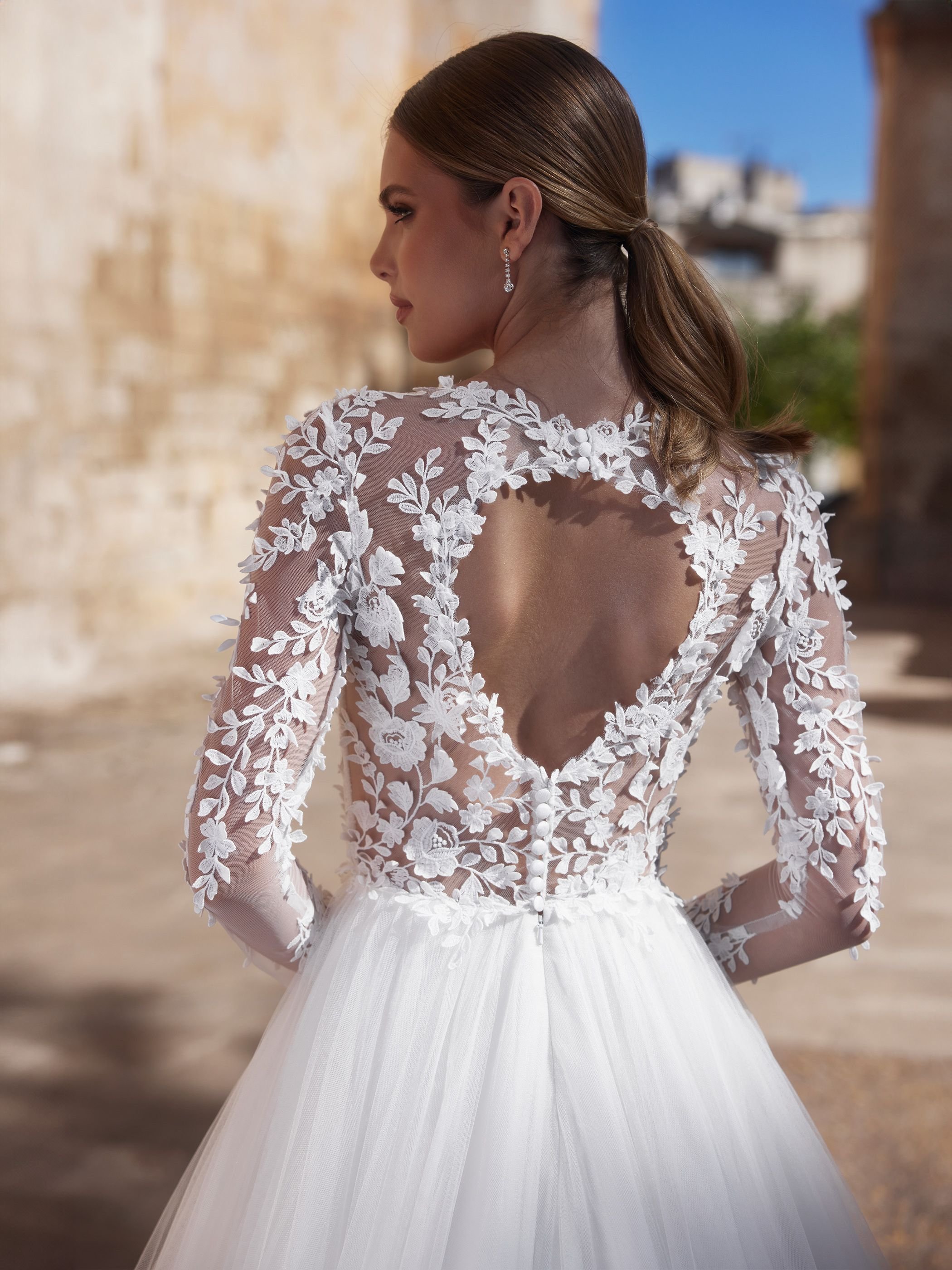 cersey back close.jpg  Cersey –Long sleeve bridal gown with Key hole back and textured lace.