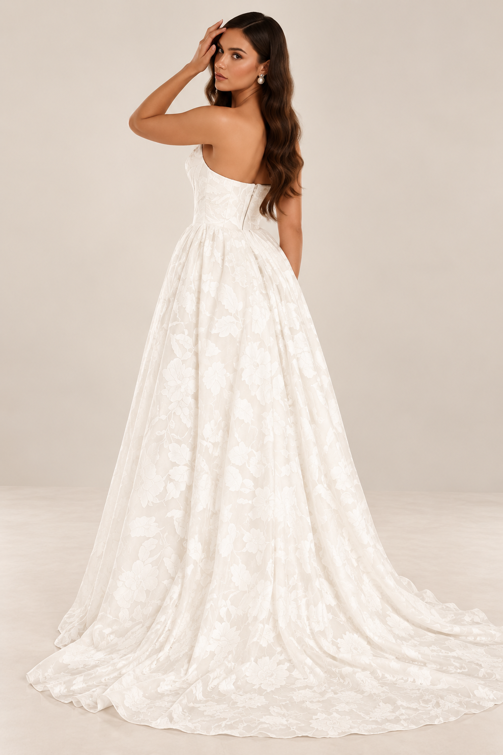 Tavelle bridal gown featuring a structured floral corset bodice and full gathered skirt viewed from the back