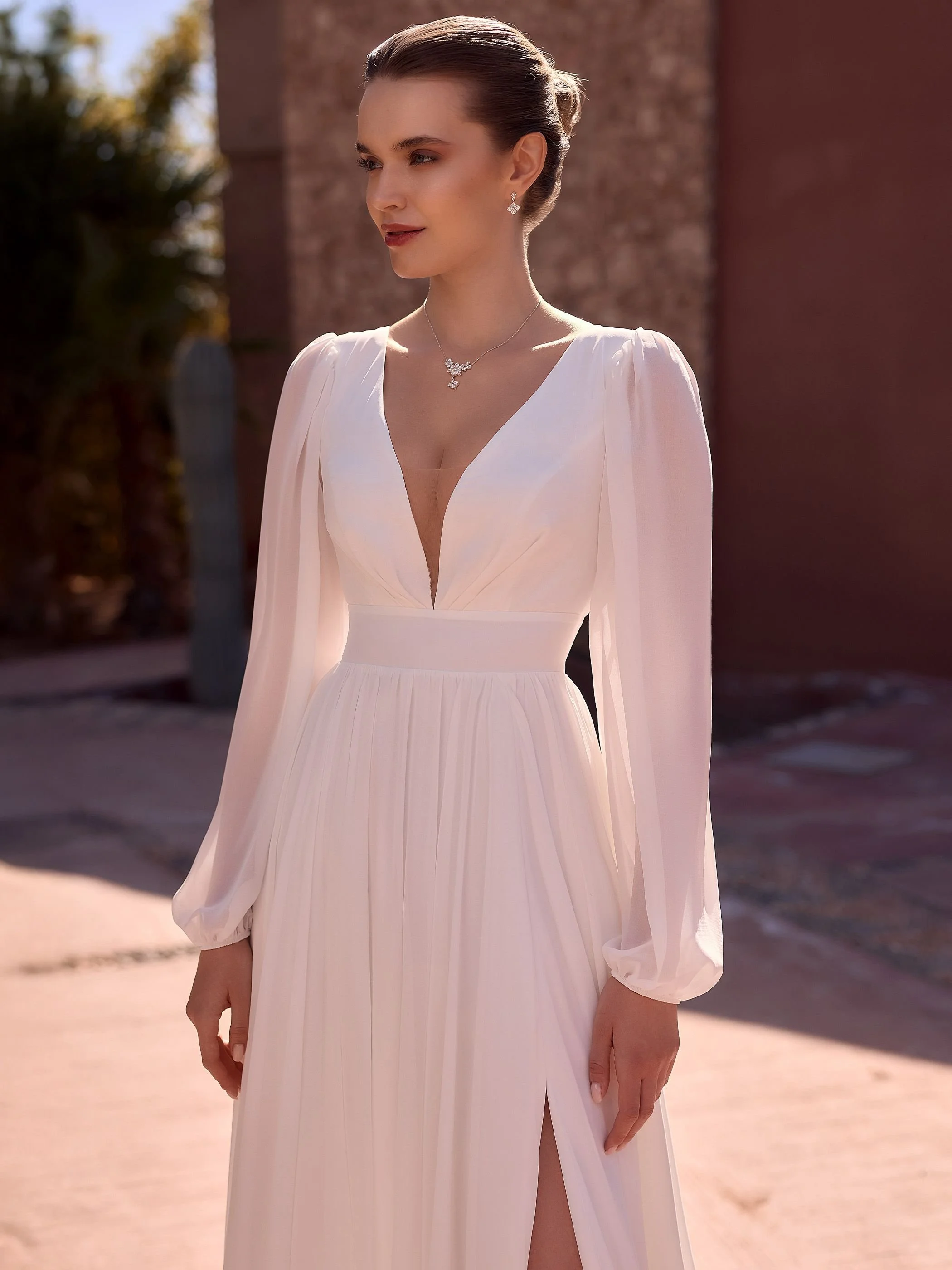 juliana close.jpgChiffon bridal gown with bishop sleeve and zip back