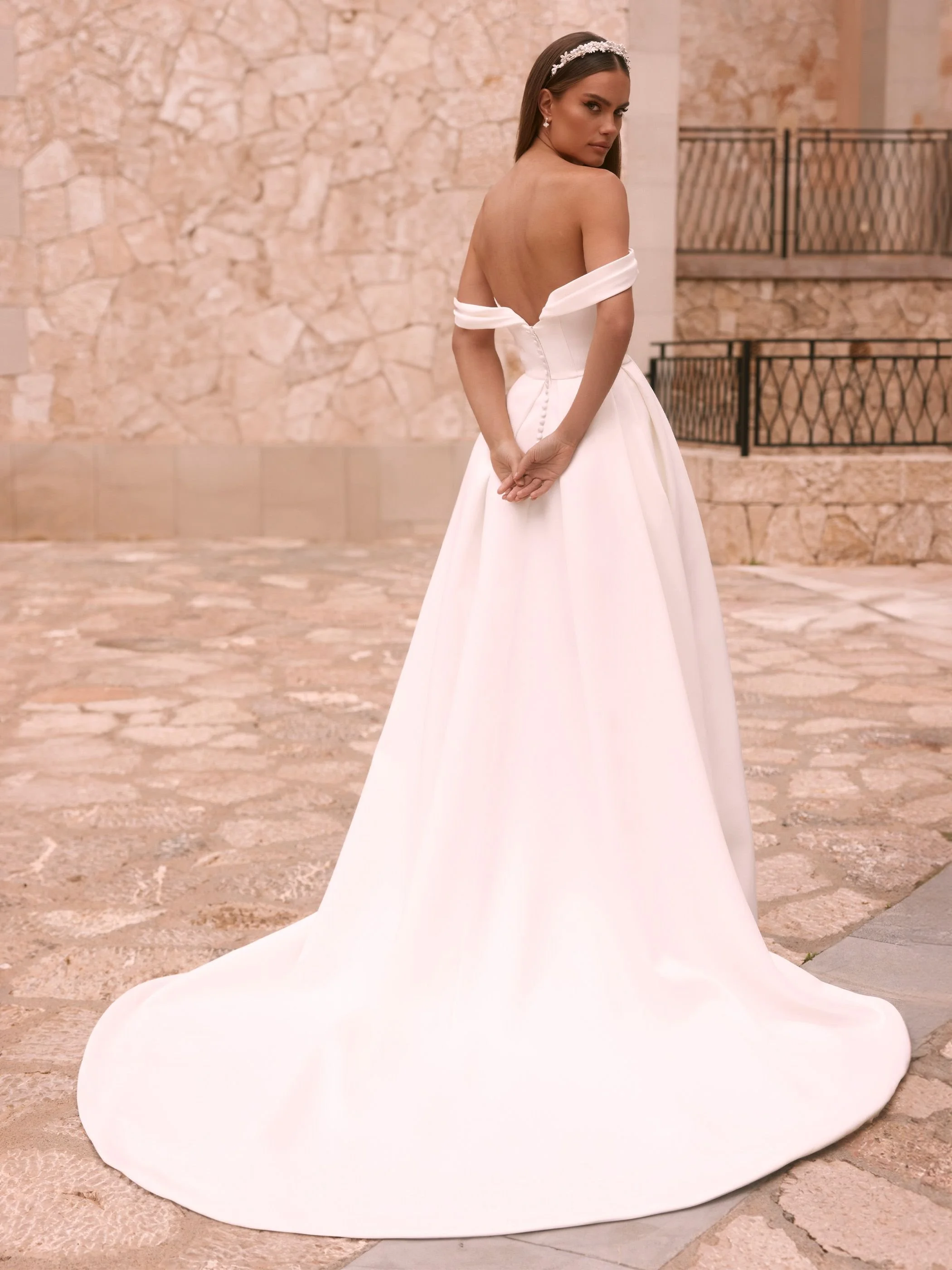 gagrias-.jpg sastin bridal gown with under bust draping and arms showing arm drape