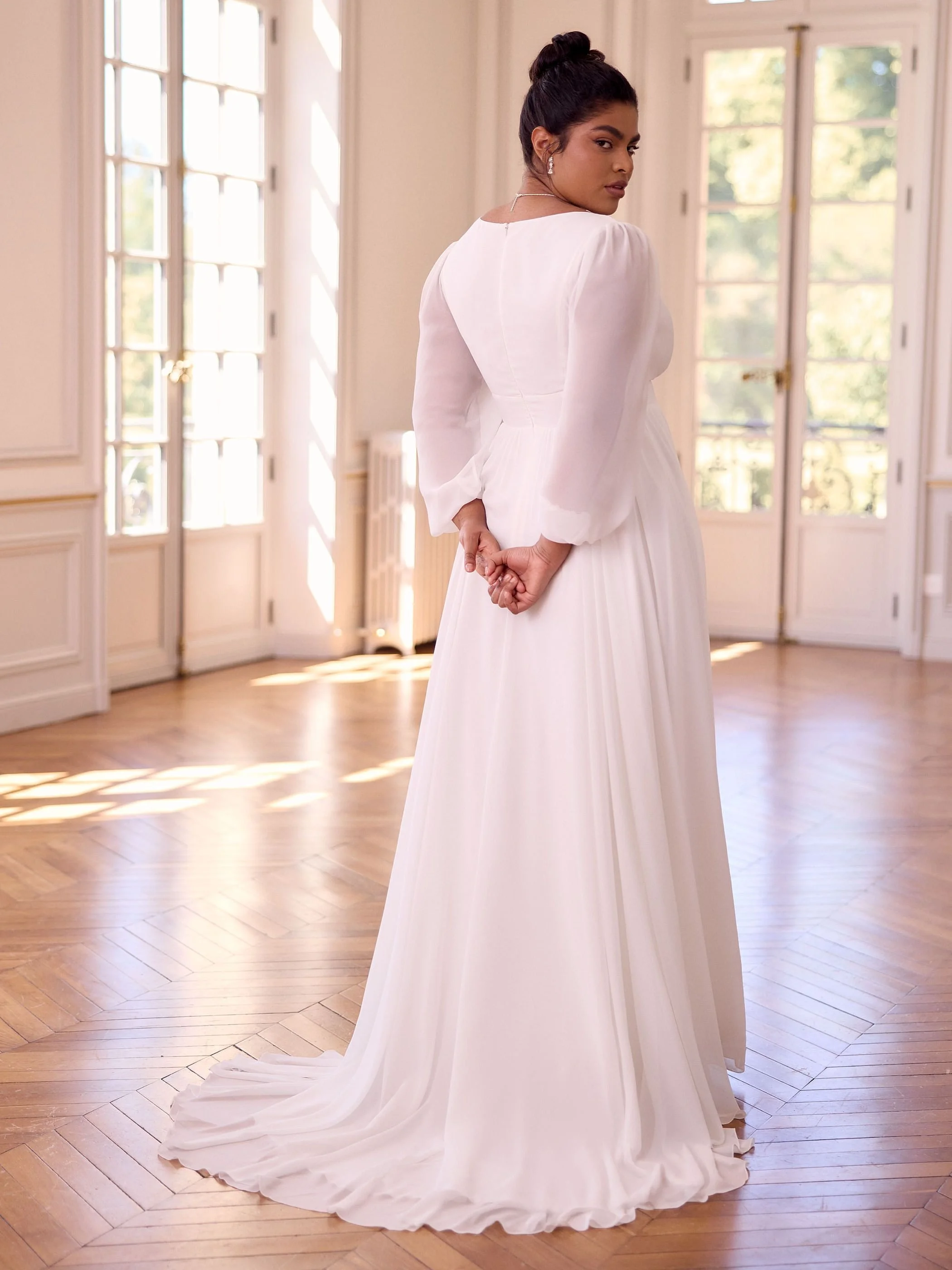 juliana- plus back.jpgChiffon bridal gown with bishop sleeve and zip back