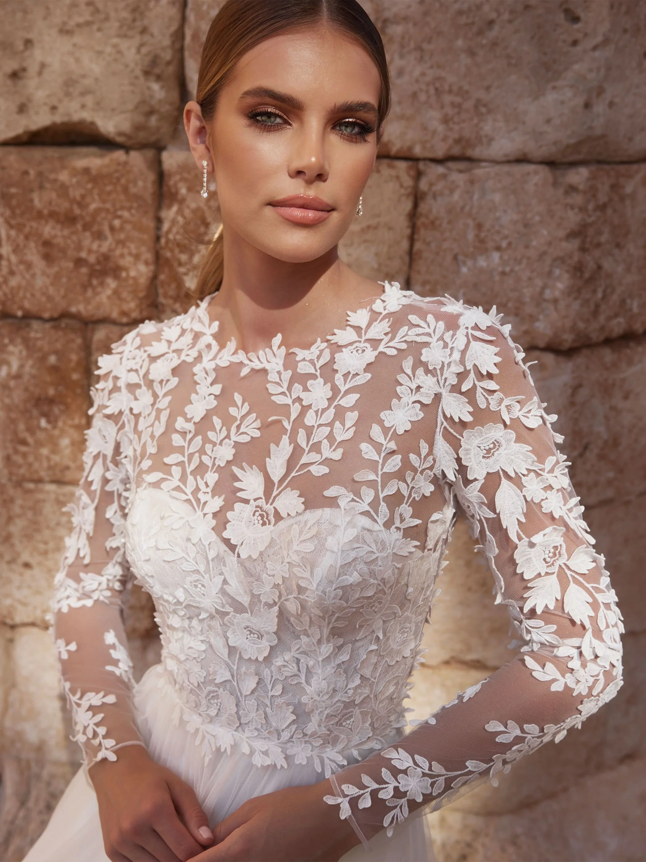 cersey- insta close.jpgCersey –Long sleeve bridal gown with Key hole back and textured lace.