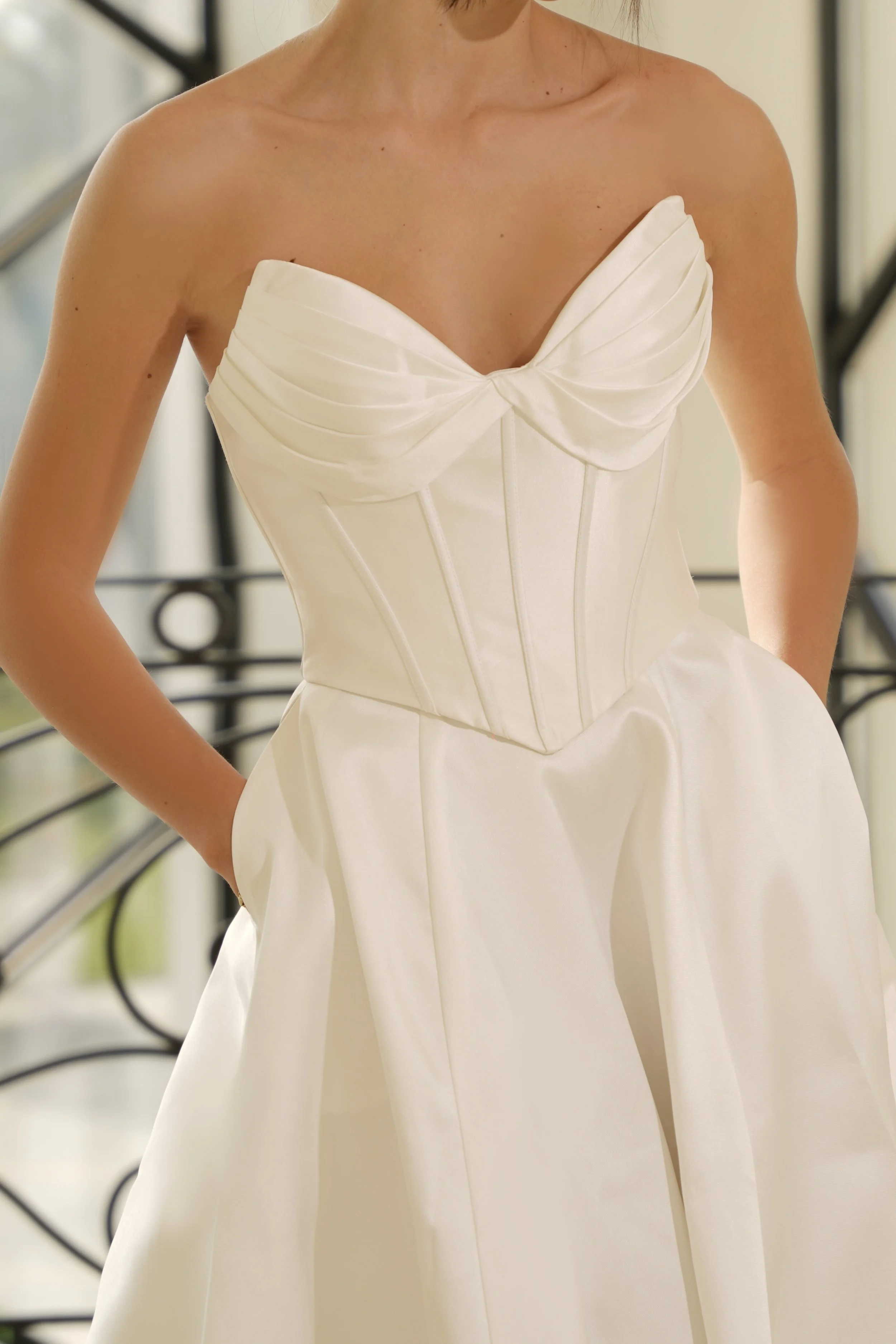 Mikado bridal gown closeup of bust with boning detail and twist feature