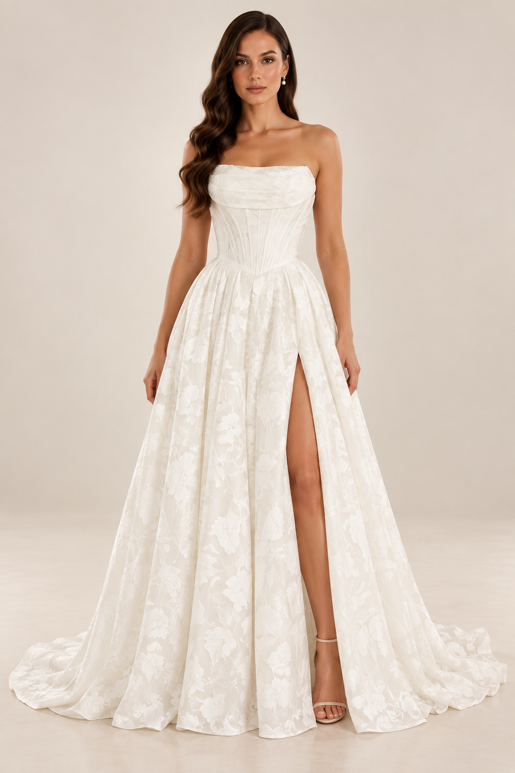 Tavelle bridal gown with strapless draped neckline, structured corset bodice and full floral textured skirt and split.