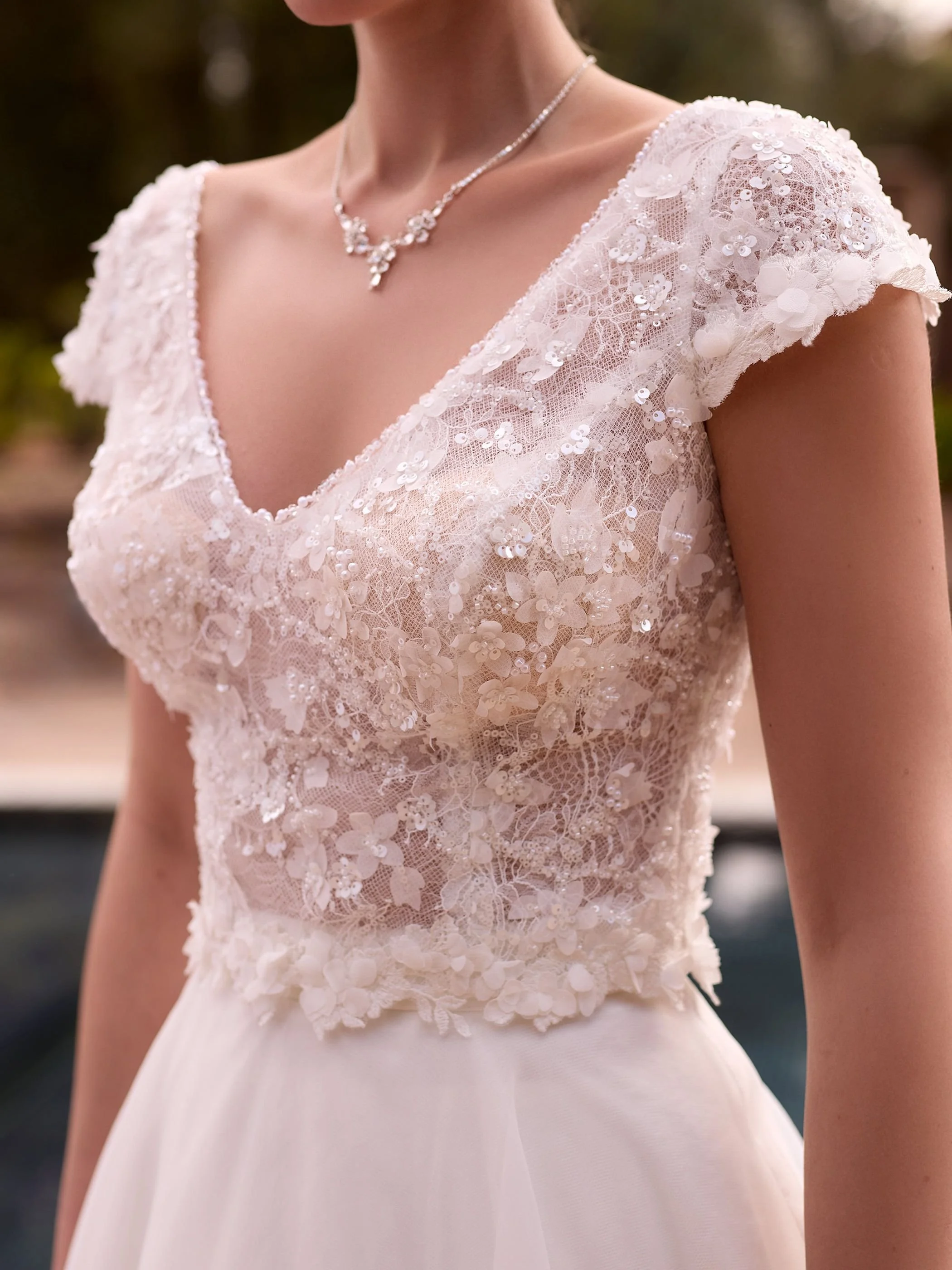 Crafted from high-quality tulle and lace, this bridal top features a flattering V-neckline framed by intricate 3D lace and subtle bead trim for a touch of shimmer