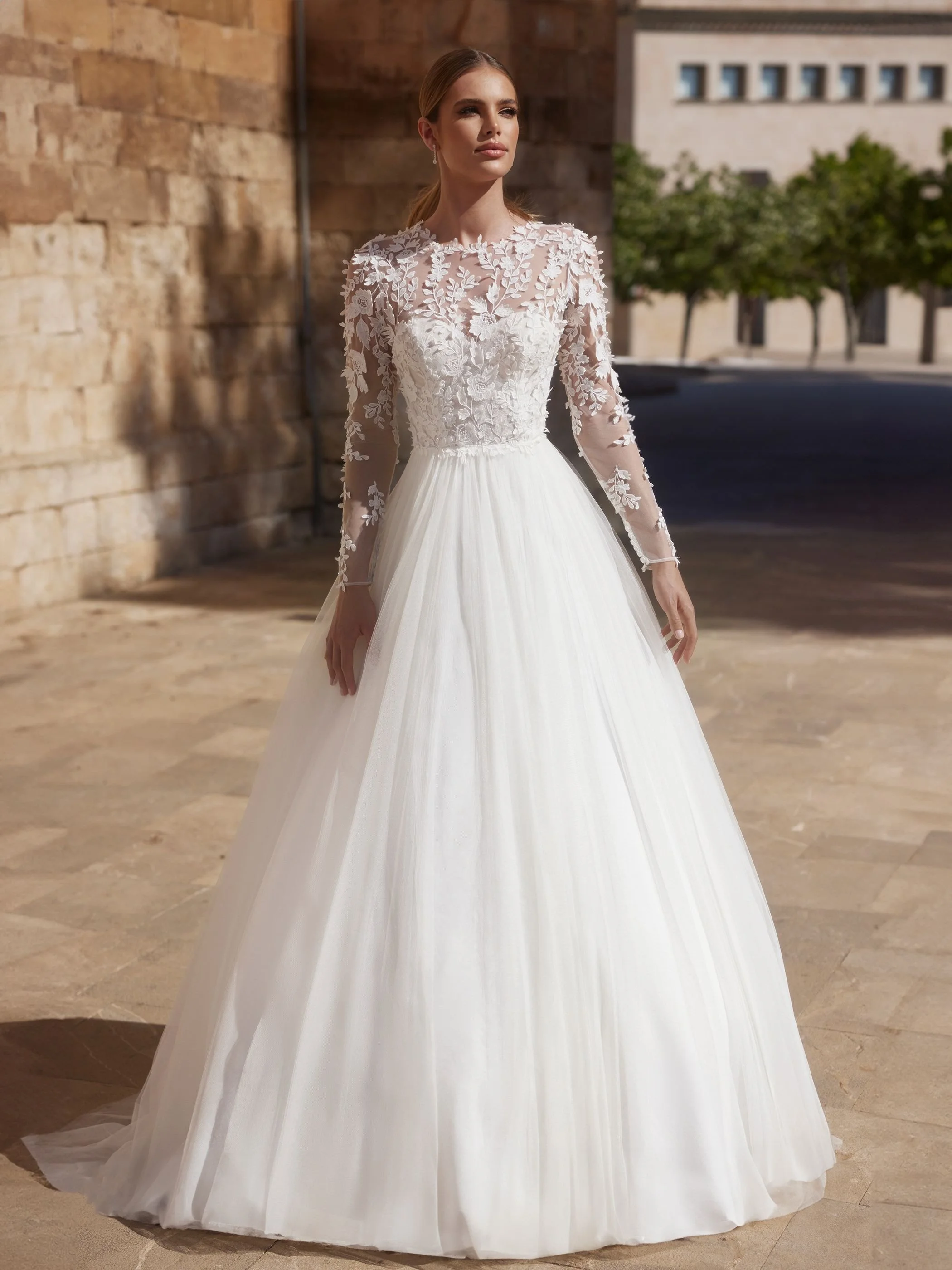 cersey-.jpg  Cersey –Long sleeve bridal gown with Key hole back and textured lace.