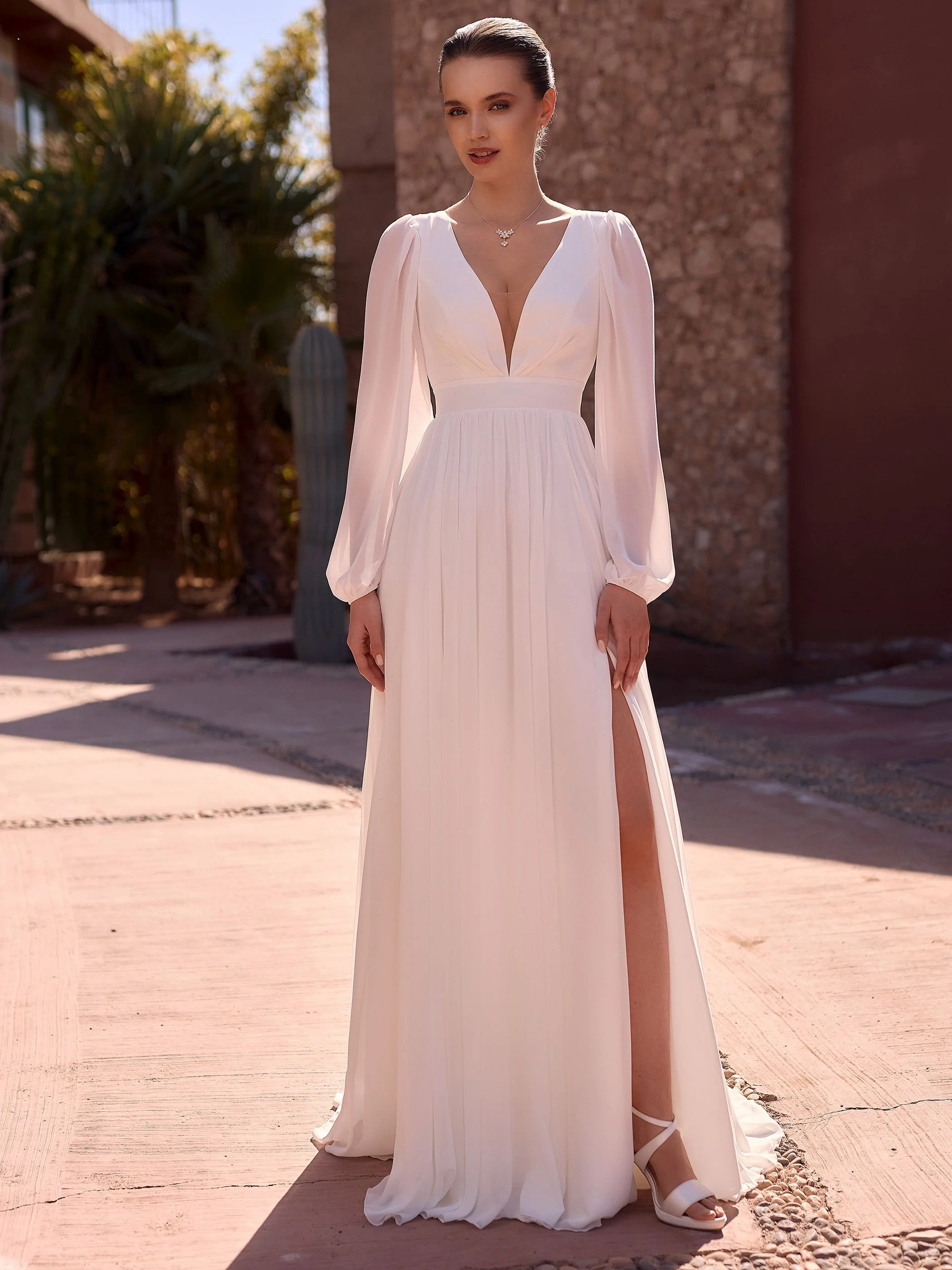 Chiffon bridal gown with bishop sleeve and zip back