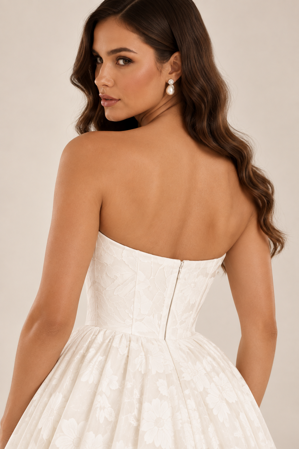Tavelle bridal gown featuring a structured floral corset bodice and full gathered skirt viewed from the back