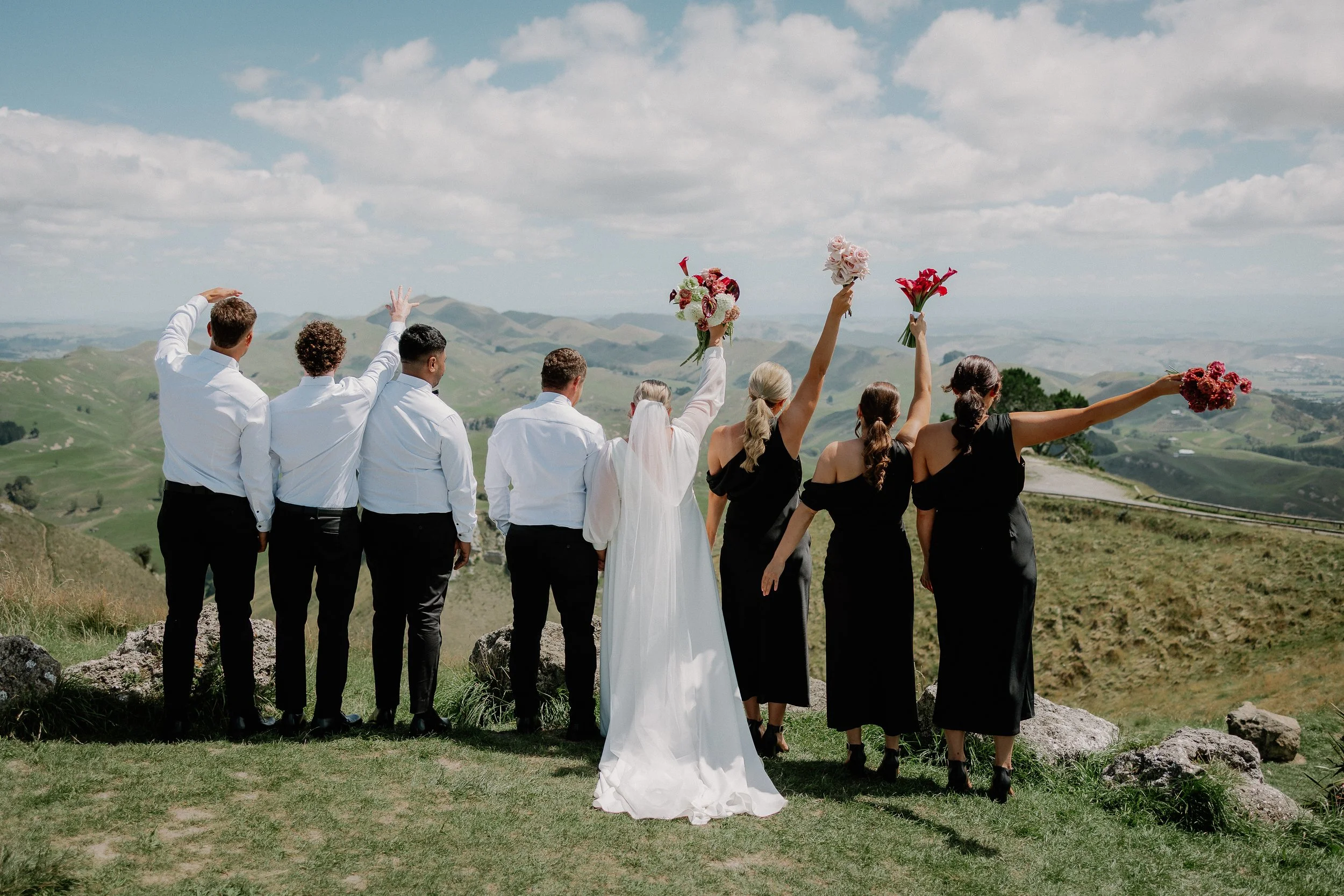 Bridal party on high peak with spectacular view