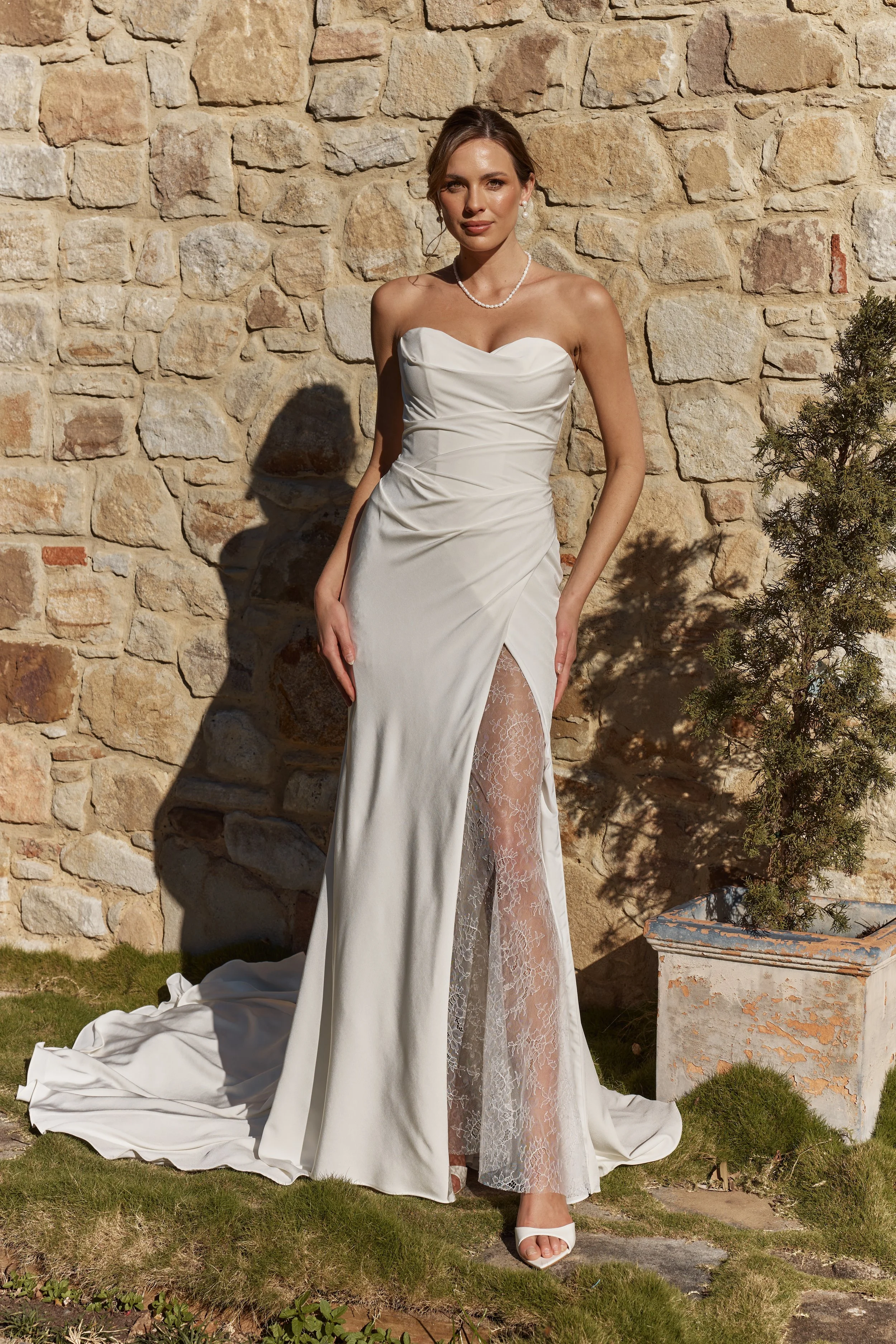 Edelweiss strapless crepe wedding dress with slit and chapel train front view