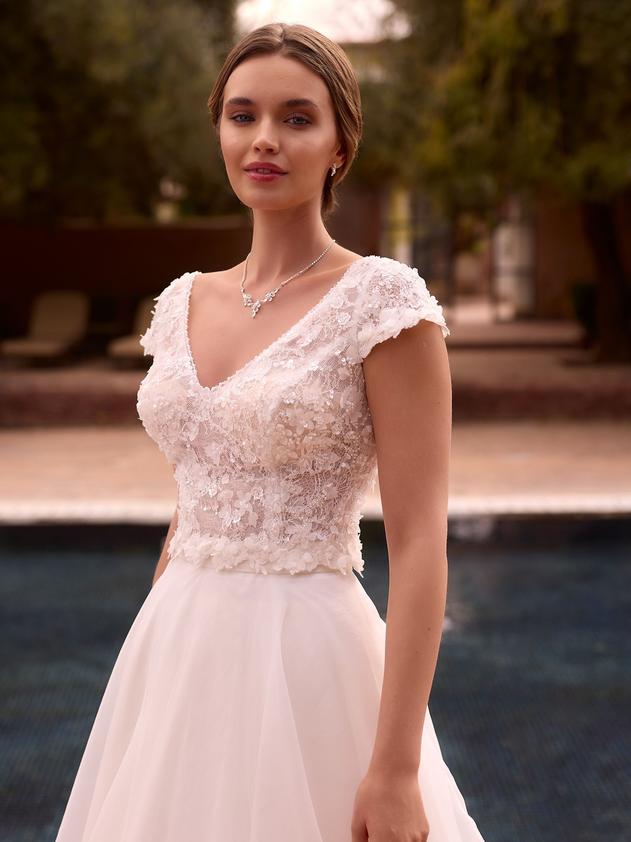 Crafted from high-quality tulle and lace, this bridal top features a flattering V-neckline framed by intricate 3D lace and subtle bead trim for a touch of shimmer