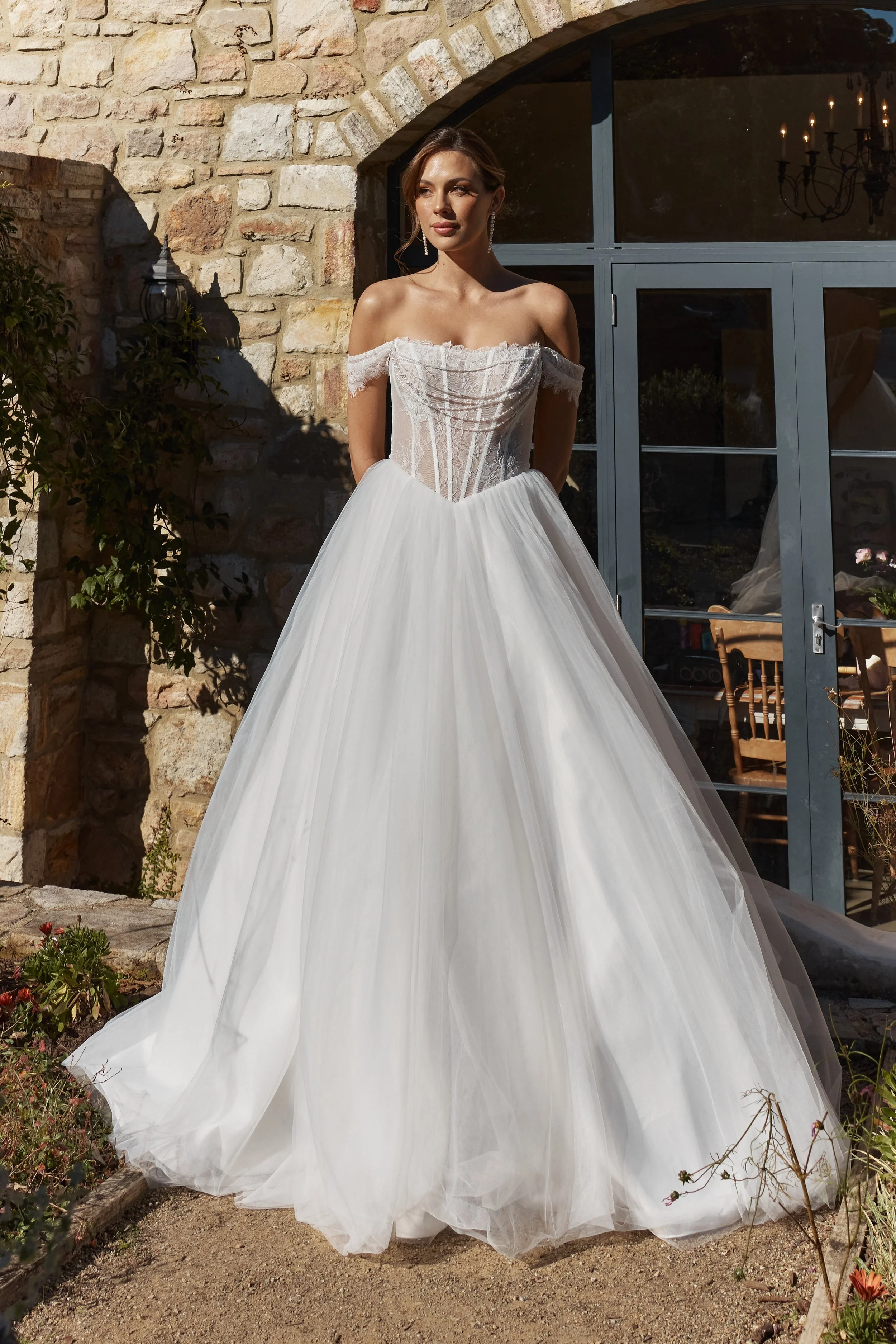Stellaria romantic tulle ball gown with illusion lace bodice, basque waist, detachable crystal and pearl drape and cathedral train