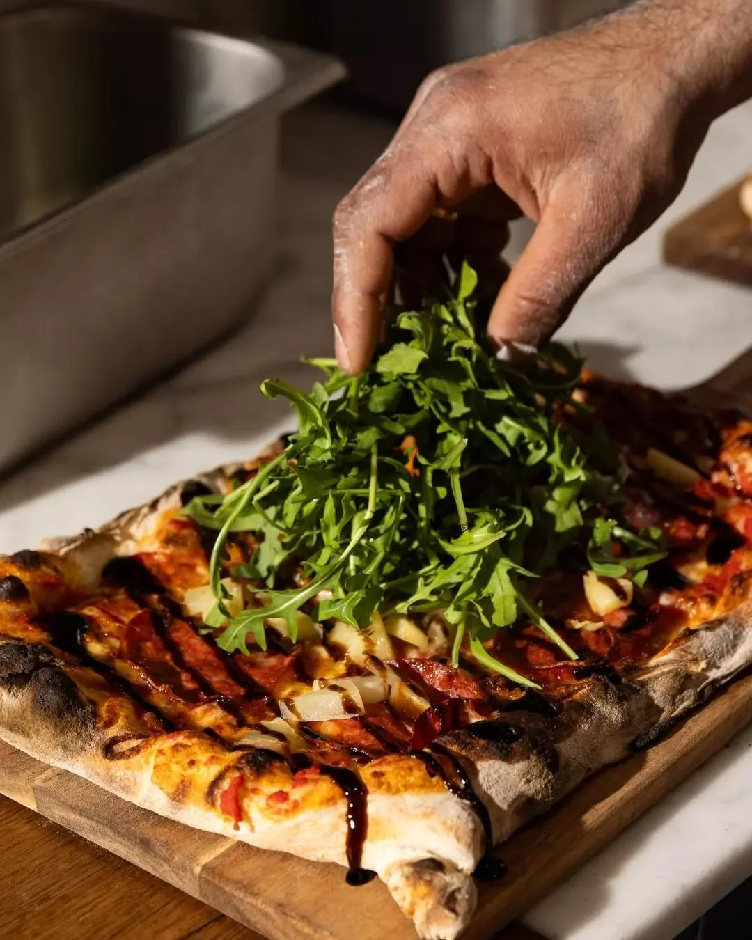 Our West is Best pizza is a perfect balance of flavours.
Sweet pineapple and tangy balsamic meet spicy hot salami, fresh rocket, and molten mozzarella, all layered on our signature Roman-style base.