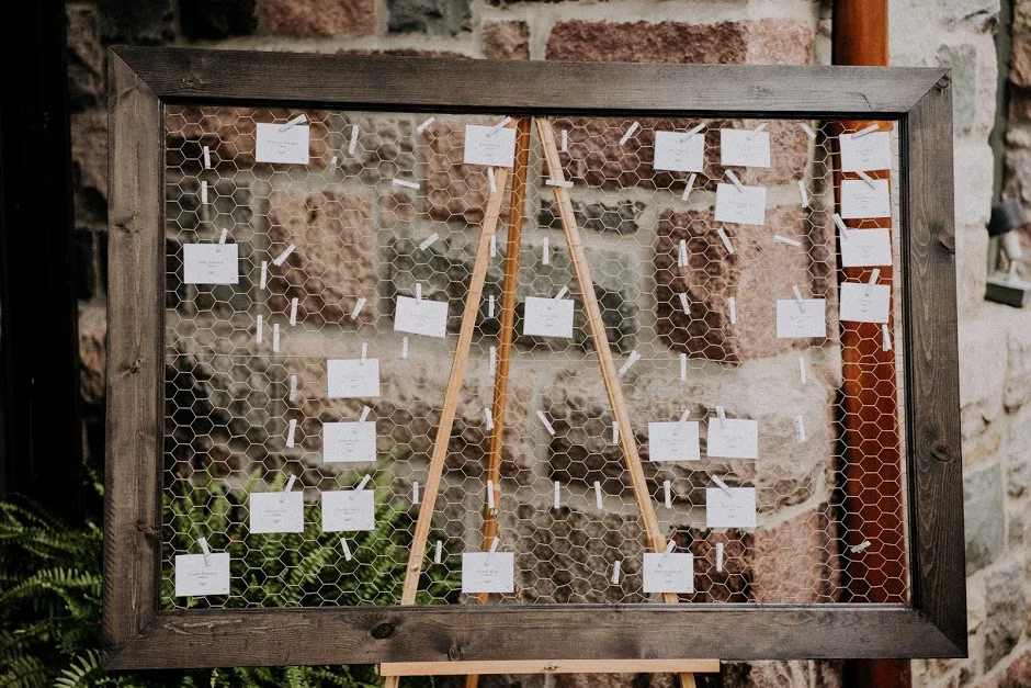 The place card aftermath on a custom frame made by the groom! 