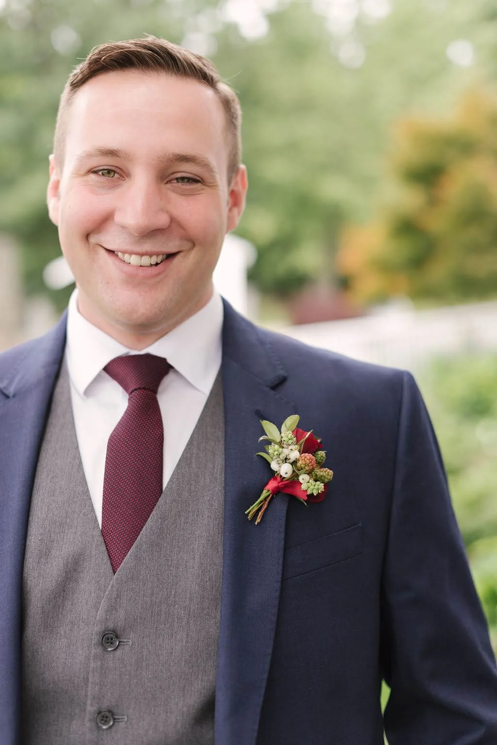 Christian and his groomsmen looked so handsome in their navy suits with burgundy accents.