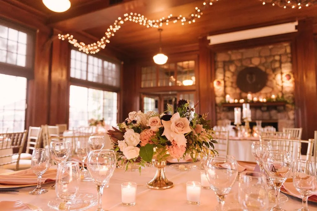Lush, textured floral arrangements featured a color palette of blush, mauve, burgundy, ivory and greens.