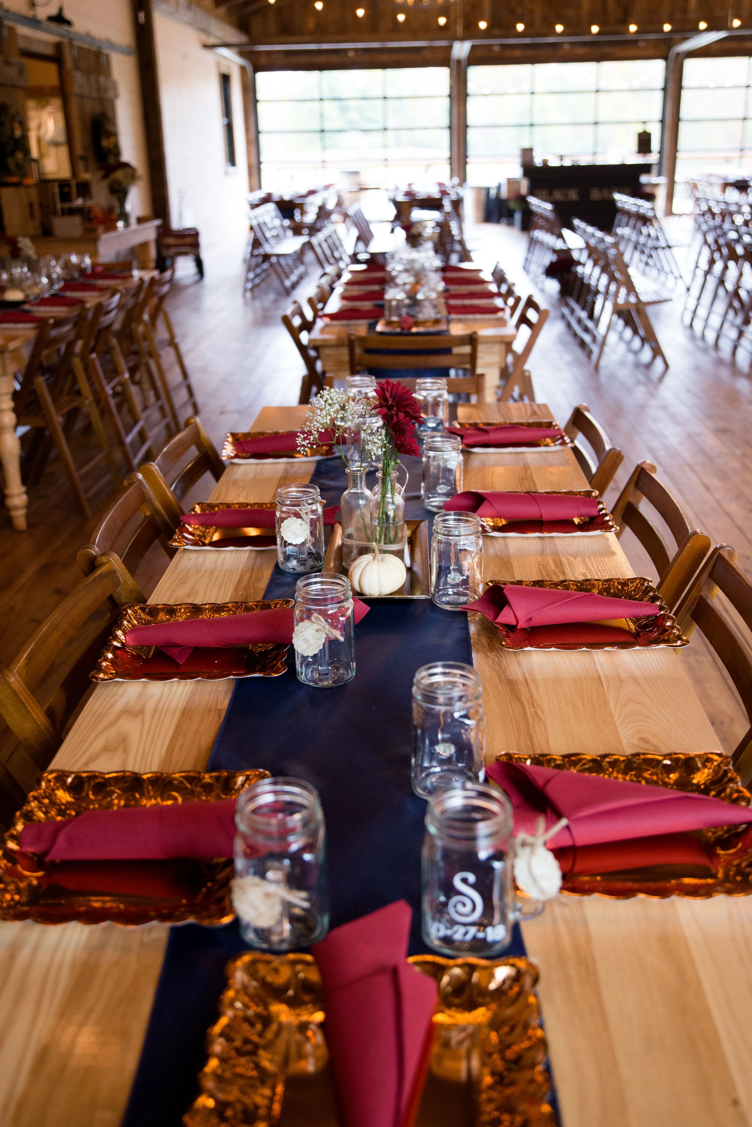 Navy, copper and burgundy accents added pops of color throughout the room.