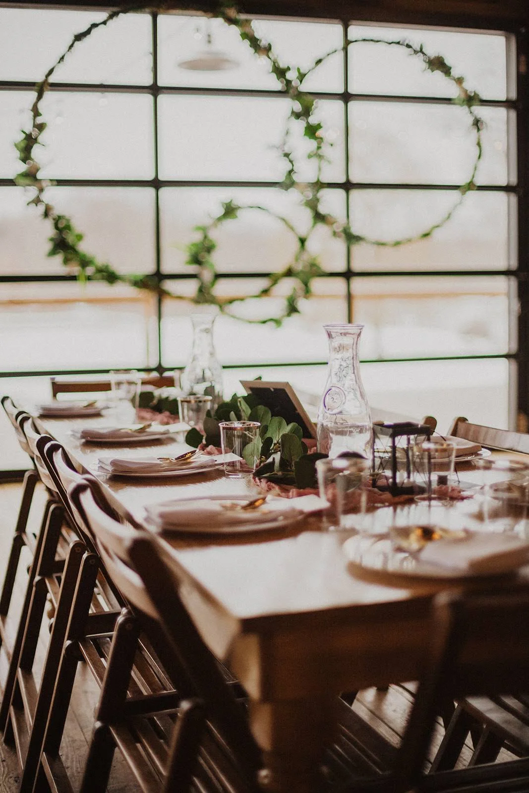 Tables were accented with gold silverware, mauve runners and eucalyptus garlands.