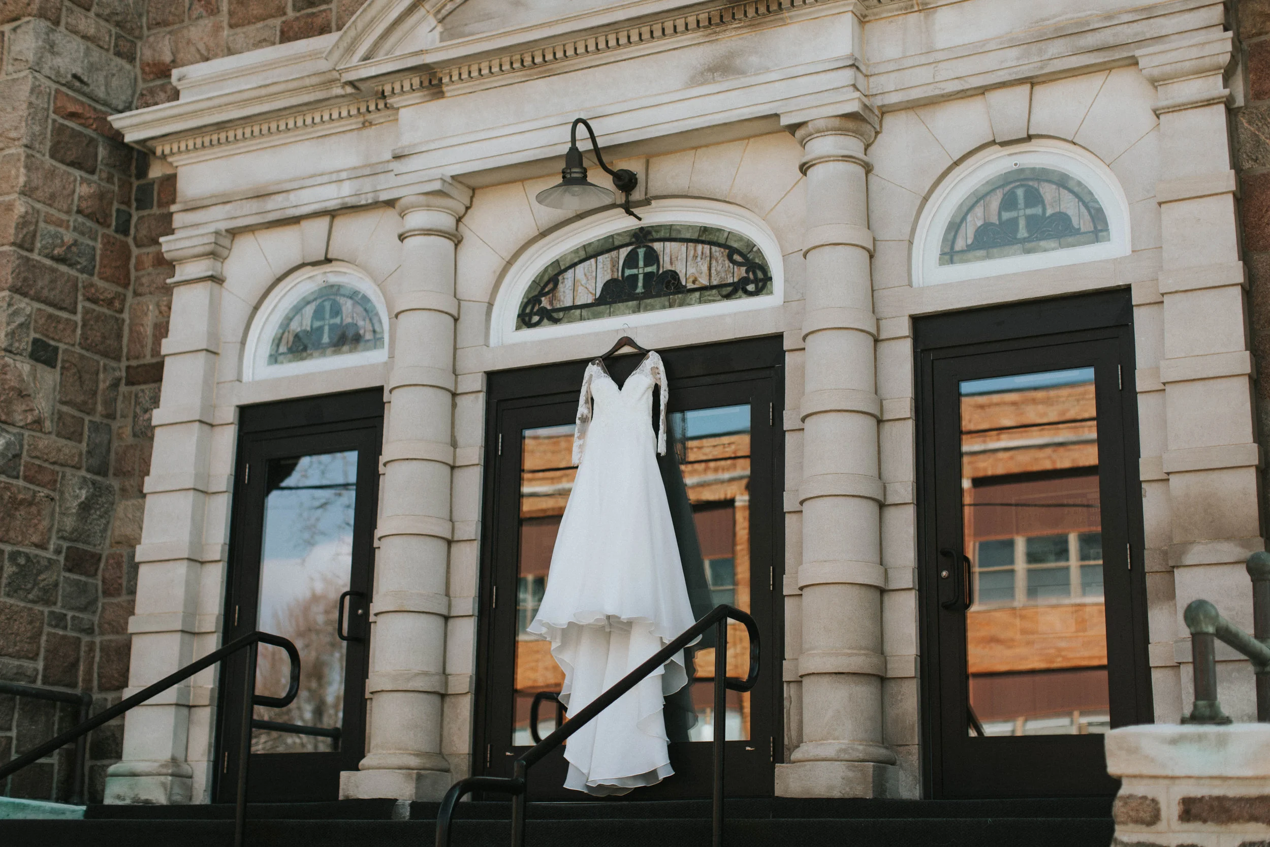 How gorgeous is her dress hanging in front of the church?