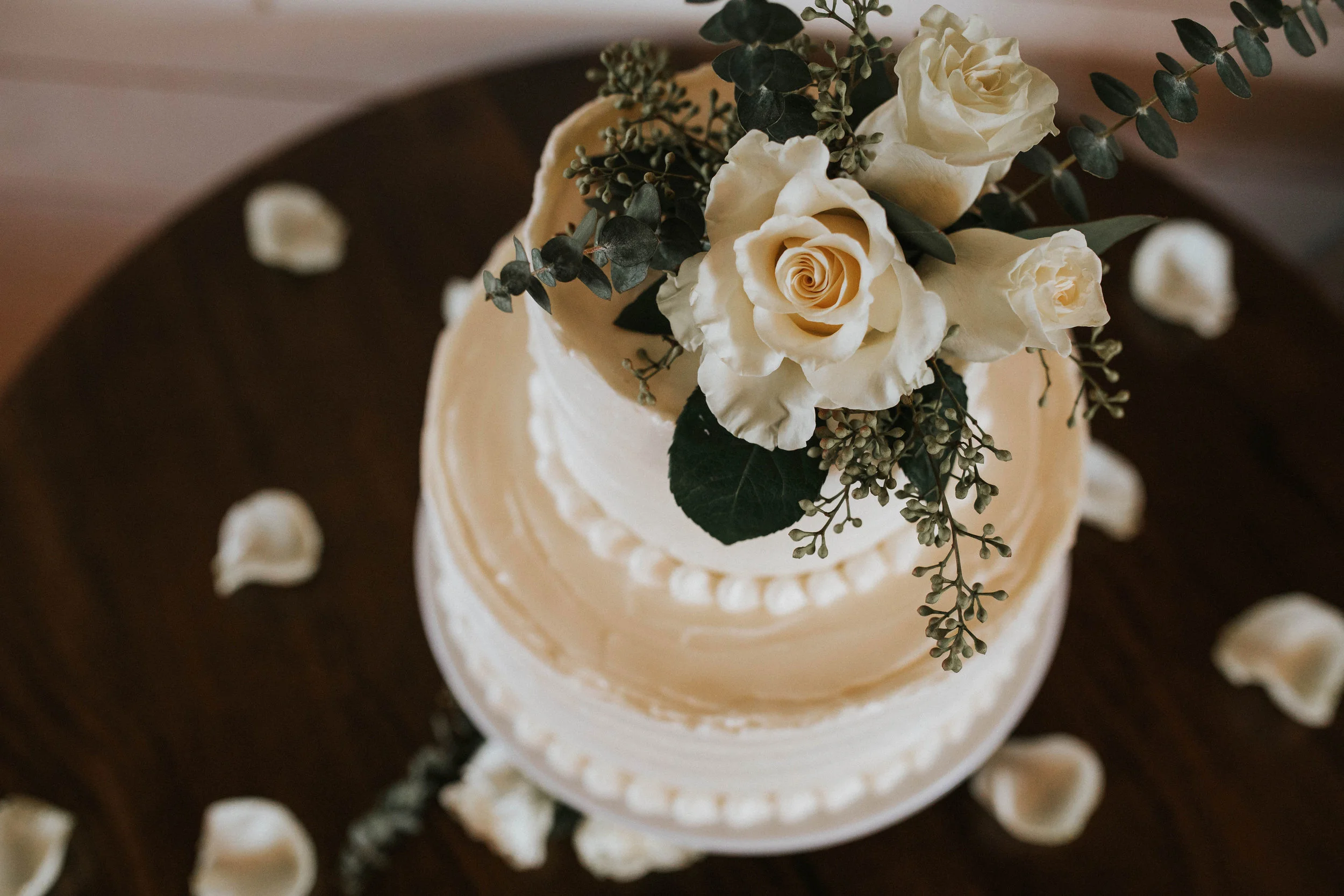 Coordinating florals embellished their couple’s cake and added just the right amount of texture.