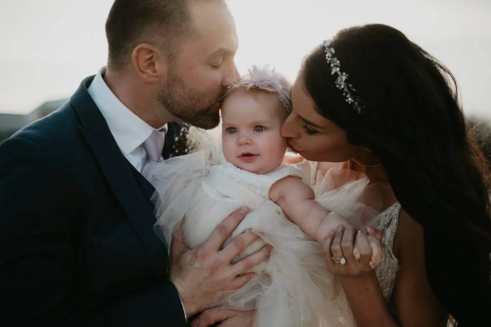 Sweet Eastyn slept through the ceremony and woke up just in time for this beautiful family picture!