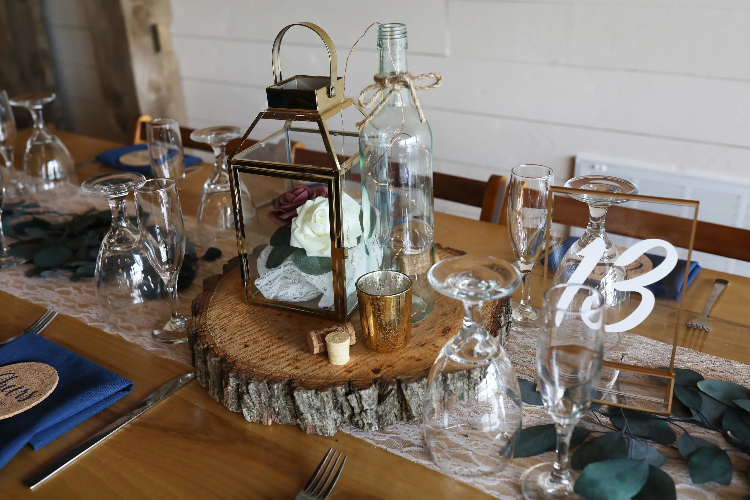 Centerpieces included a collection of lanterns, candles, lace and greenery.