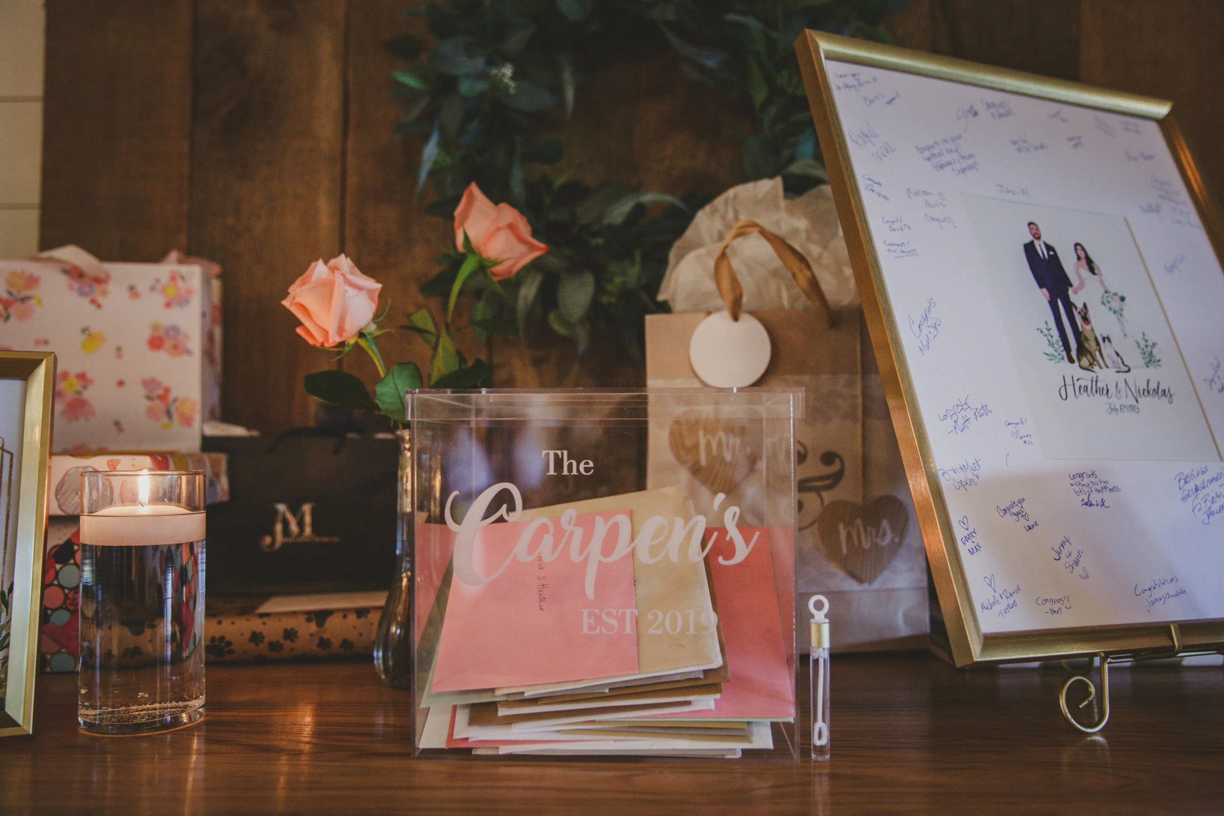 A painting of the couple with their pets served as their guest book and a personalized card box adorned the gift table