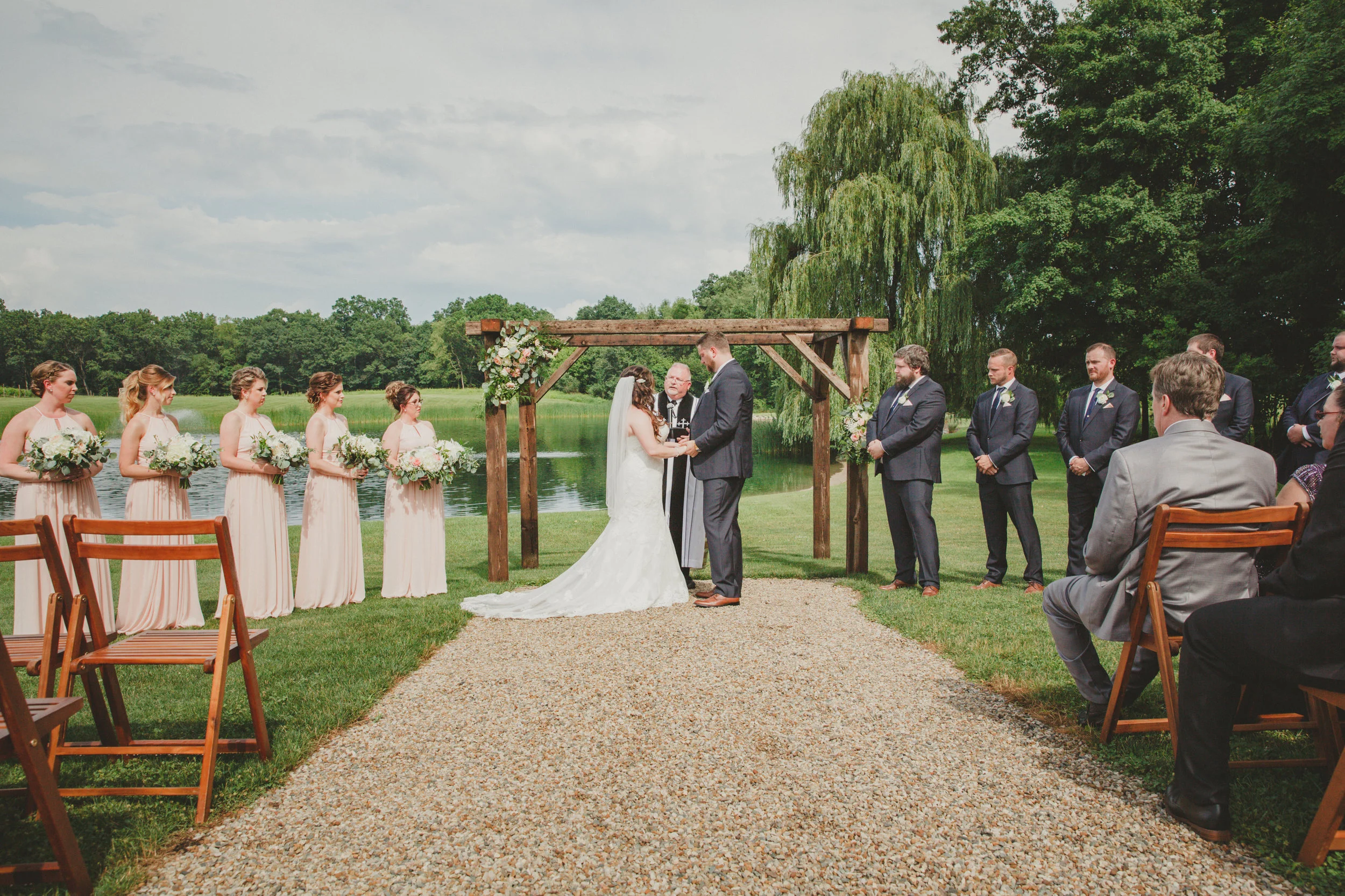 A gorgeous ceremony outside in front of the lake.