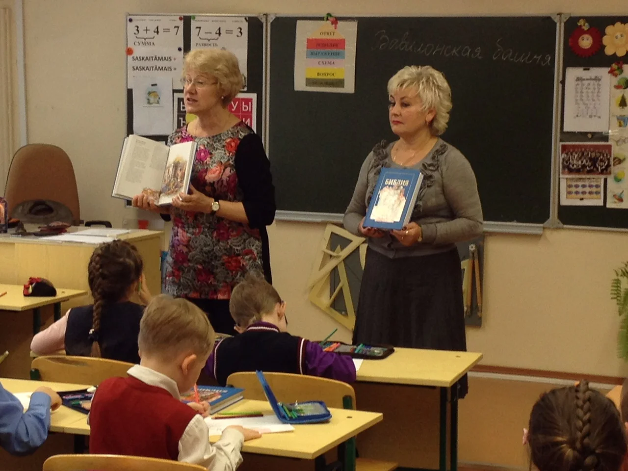 Dr. Olga assists a teacher in a classroom in Samara, Russia