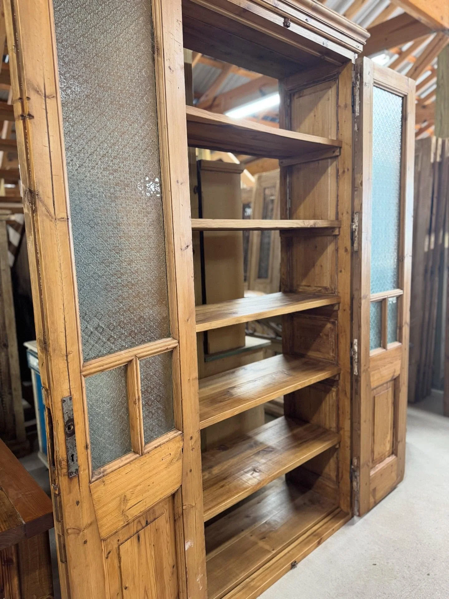 Matching custom cabinets designed and made in house using our antique architecturals. This one has the prettiest hardware. Details on this pair below. 

Custom cabinets made using 1890&rsquo;s French door units. Custom design with patterned glass and