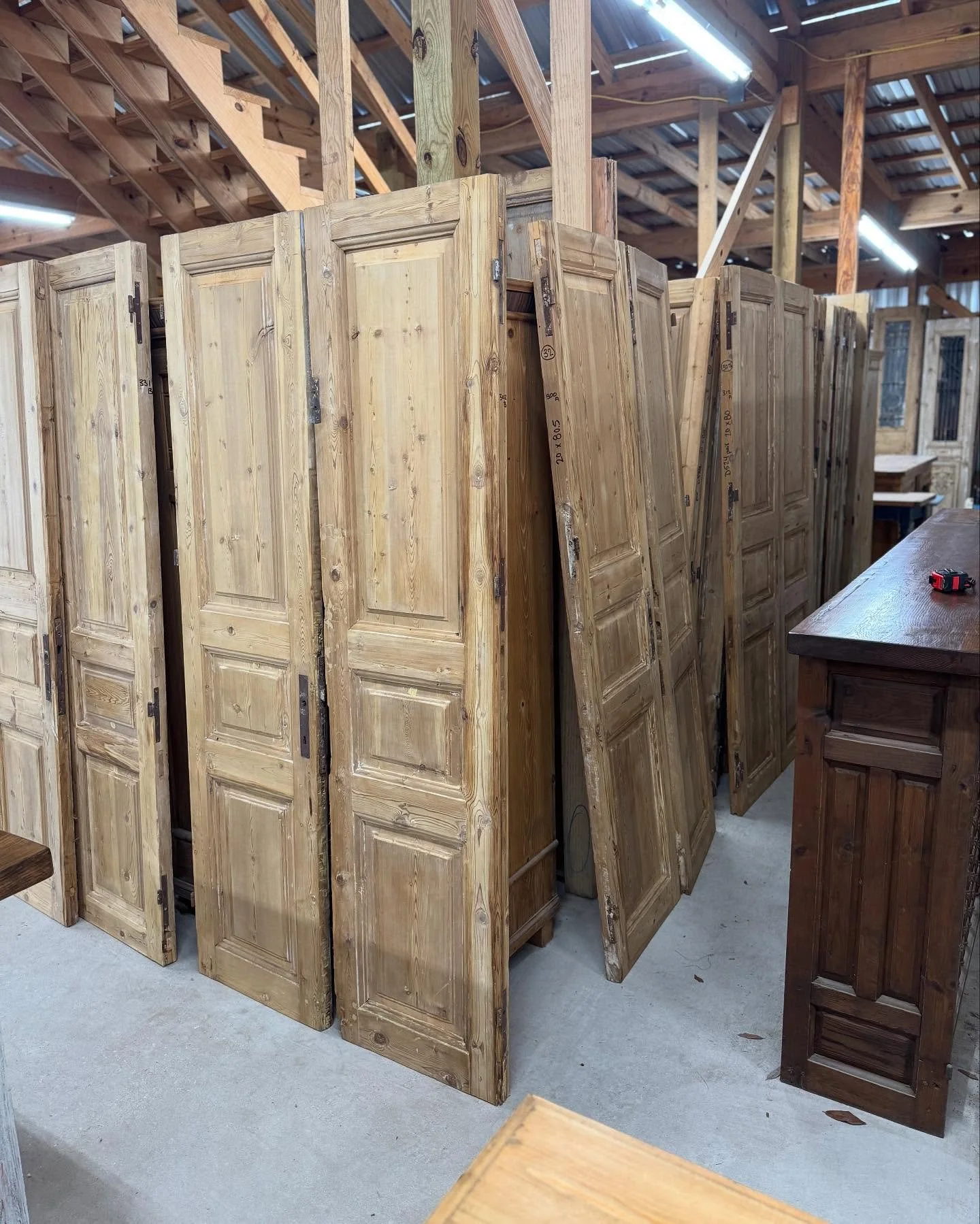 Common question: do you have any 80&rdquo; high doors?!? 

✨Answering here: Yes, we have a few to shop in-store!✨

 Here are a few shown. There are plenty more though! Im roughly counting about 45 pairs of 80&rdquo; high doors in this stack. Shop our