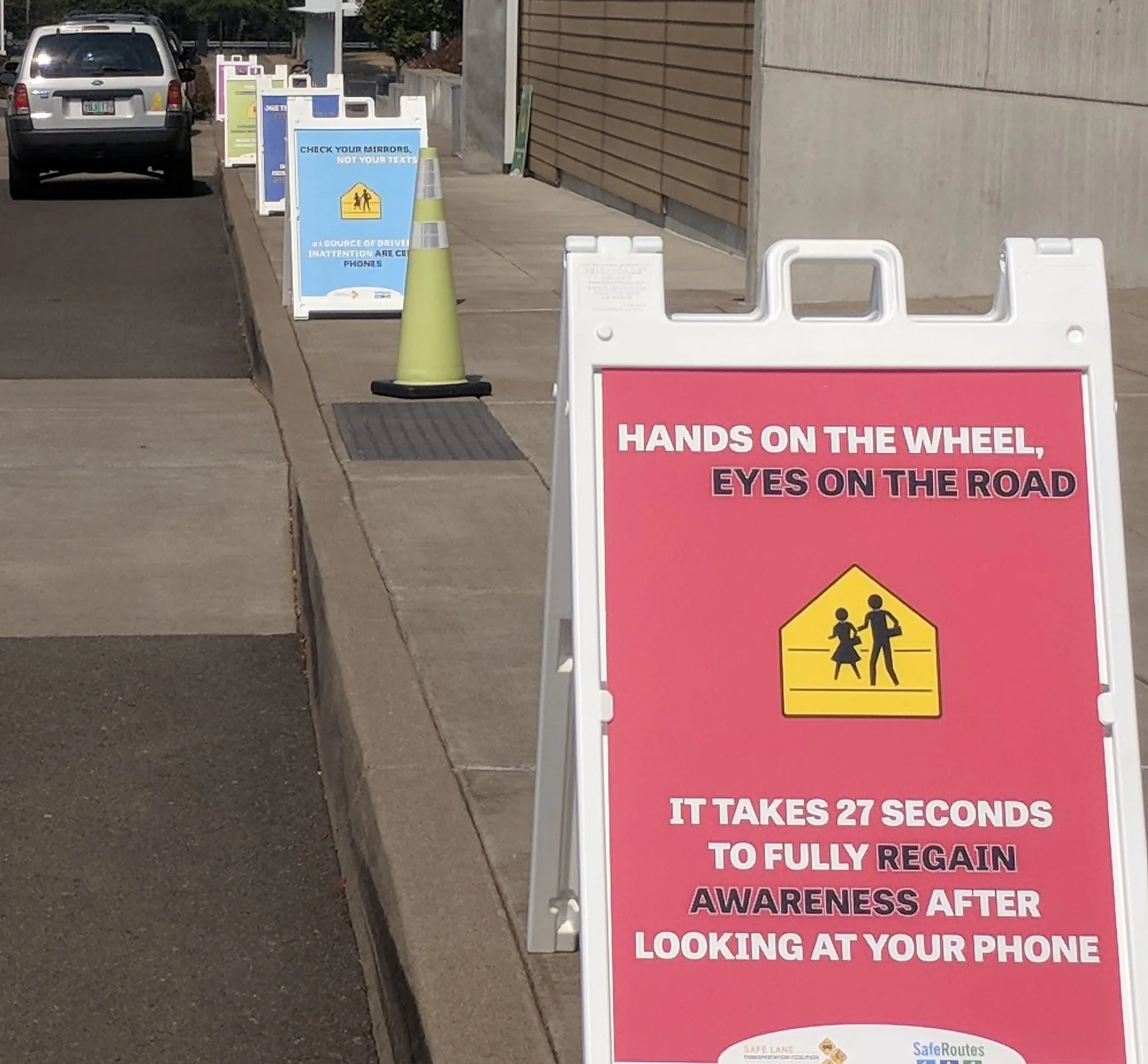 Distracted Driving Awareness Posters in front of a Lane County Elementary School.