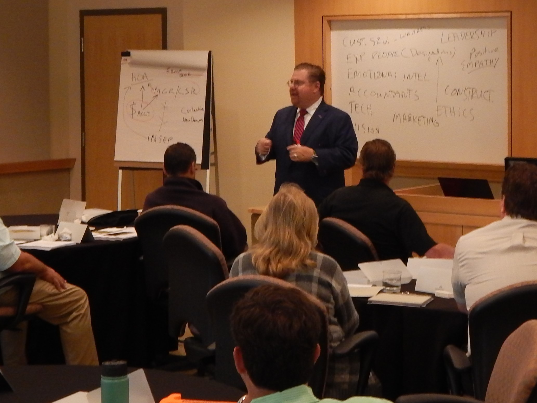 AMG president/CEO Paul Mengert (standing) teaches the 2016 Community Management course to students at the Community Associations Institute.