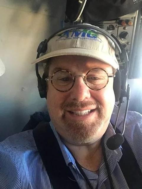 Paul Mengert, President and CEO of Association Management Group, Inc. in the cockpit of a DC8 relief mission to Puerto Rico. 