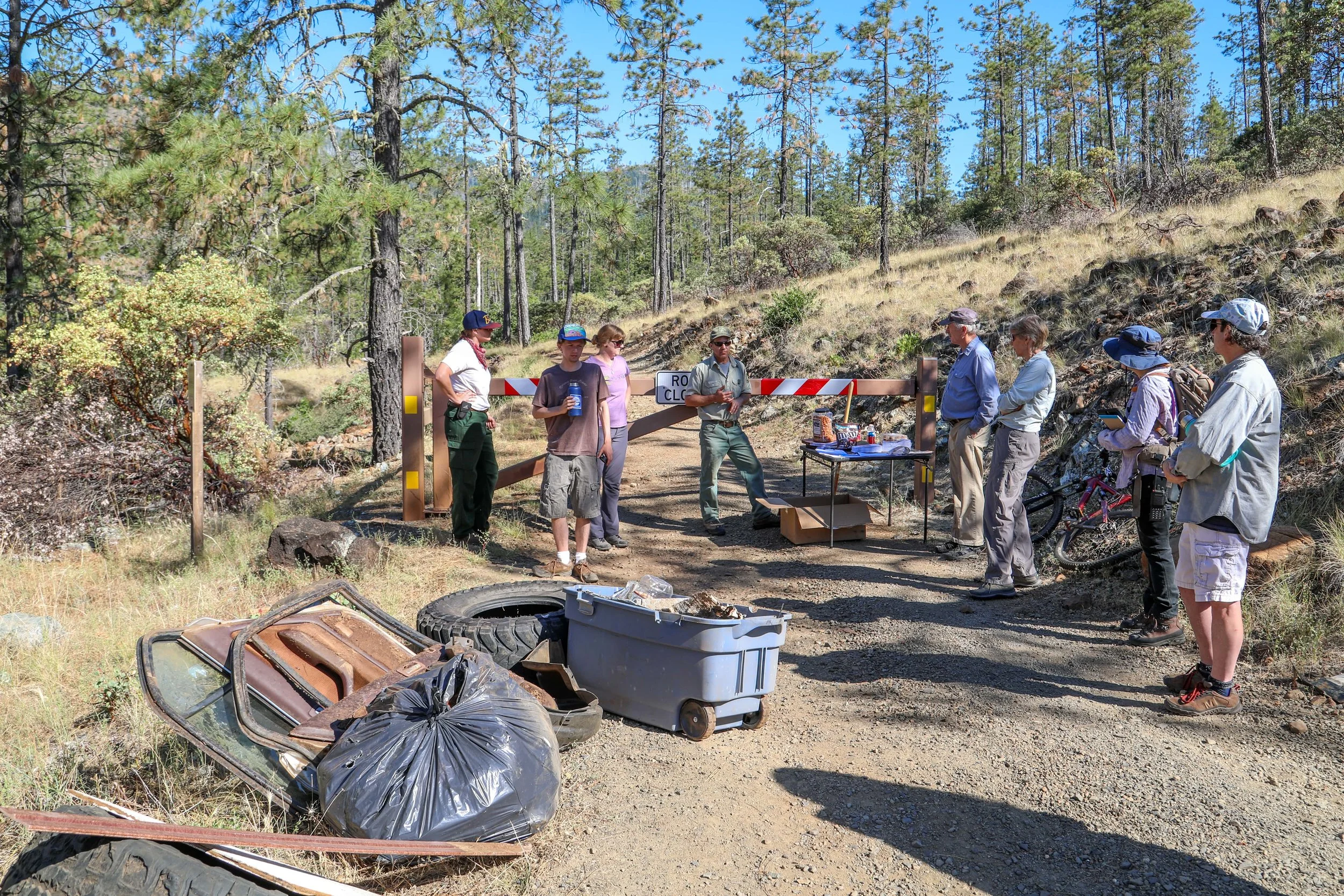 KS Wild Public Land Stewards and USFS employees cleaning up 8 Dollar Mountain Botanical Area and helping to prevent damage from future OHV use, David Christian Photo
