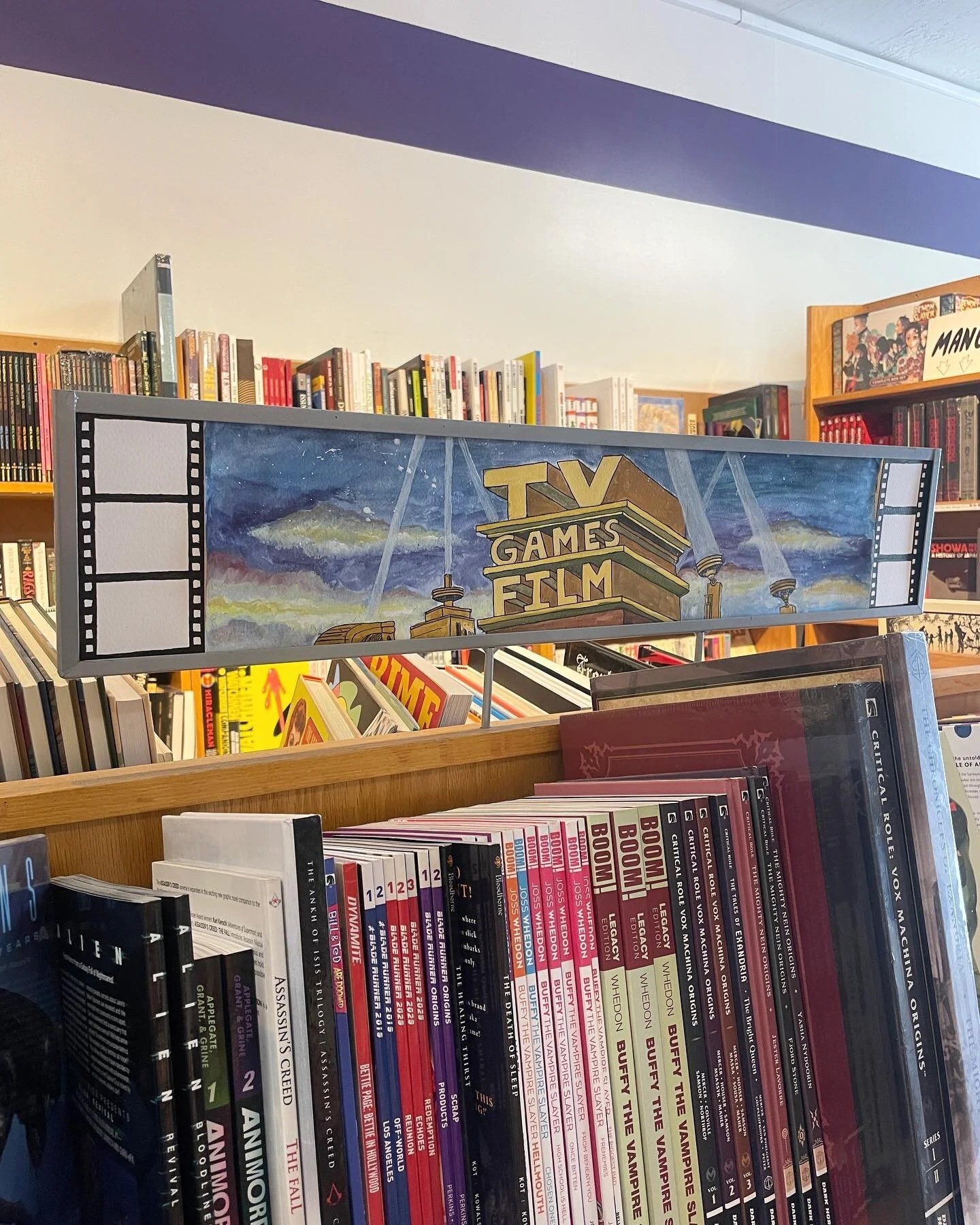 NEW @vin_decent_exposure SIGNAGE !

Behold this handpainted banger guiding you to our shelf of comics you know from flicks n things 🫴✨✨✨✨✨

We love signs you can *hear*