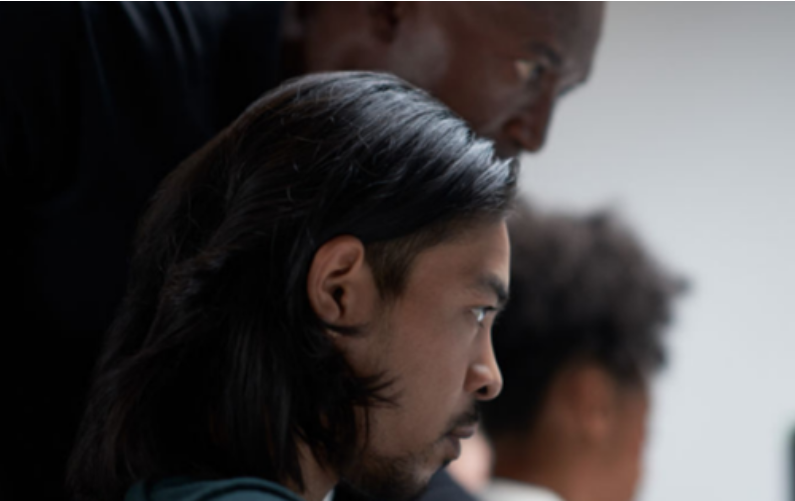 Hero image for blog. Side profiles on three men looking seriously at a computer screen. Light gray background
