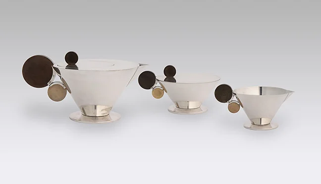 Margarete Heymann-Löbenstein, designer, German (Cologne, 1899-1990). Haël-Werkstätten, manufacturer, Germany (Marwitz, 1923-1934). Tea Service , ca. 1930. Alpacca (silvered metal alloy) with synthetic resin. Purchase: the Charlotte and Perry Faeth Fund, 2005.26.1-3.