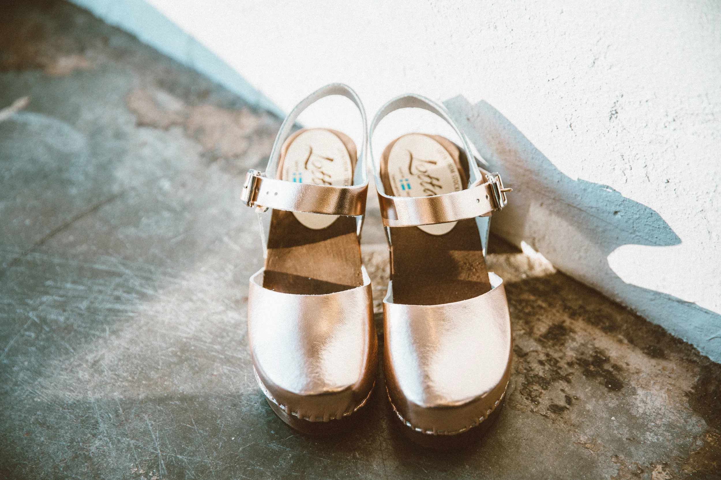 Rose gold clogs from We Are Sincerely Yours.