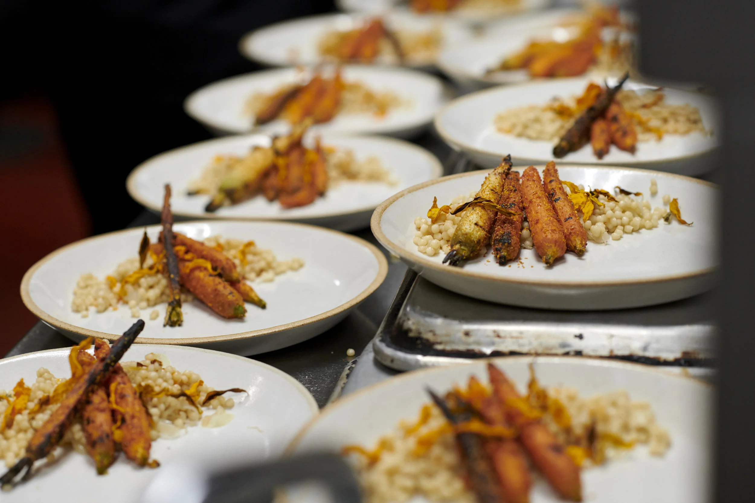 Grilled Carrot Salad with gazpacho powder, couscous, and chili oil. Photo by Kenny Johnson