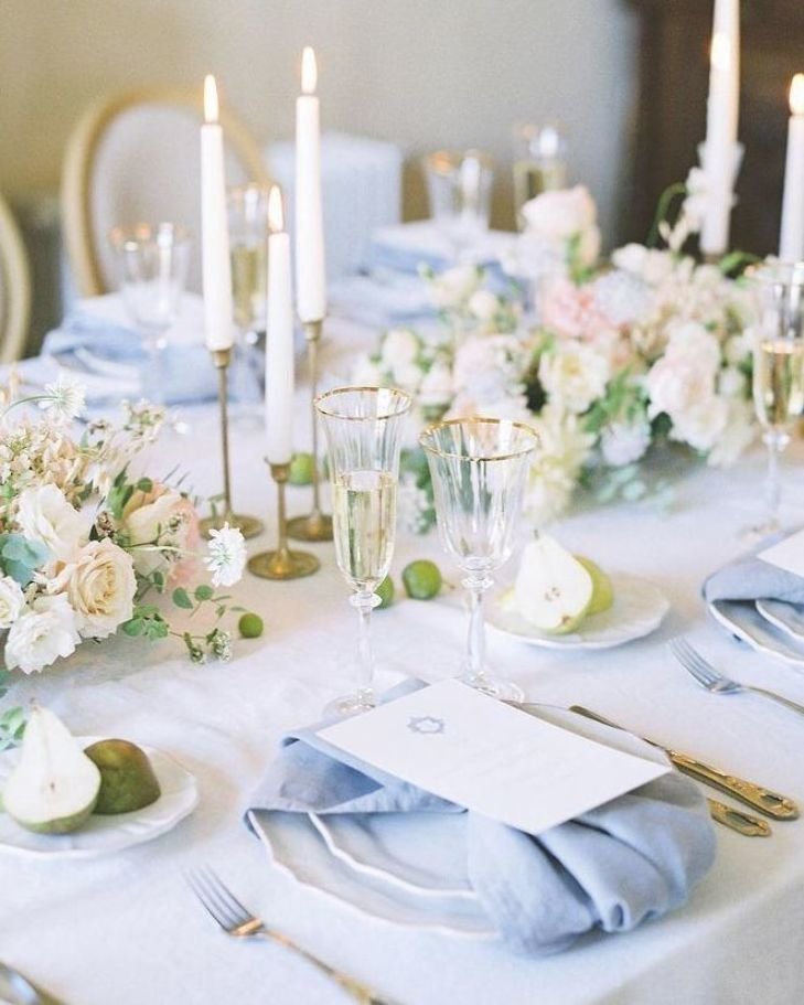 this classic and elegant table decoration for a wedding reception comes in white and light blue with these light blue napkins and the white and minty green centerpieces and the golden details   #weddinginspo #we.jpg