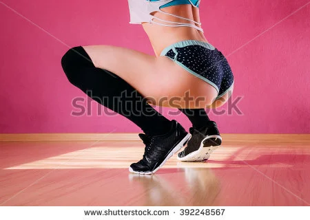 stock-photo-attractive-girl-dancing-twerk-in-the-studio-sitting-on-the-floor-on-a-pink-background-392248567.jpg